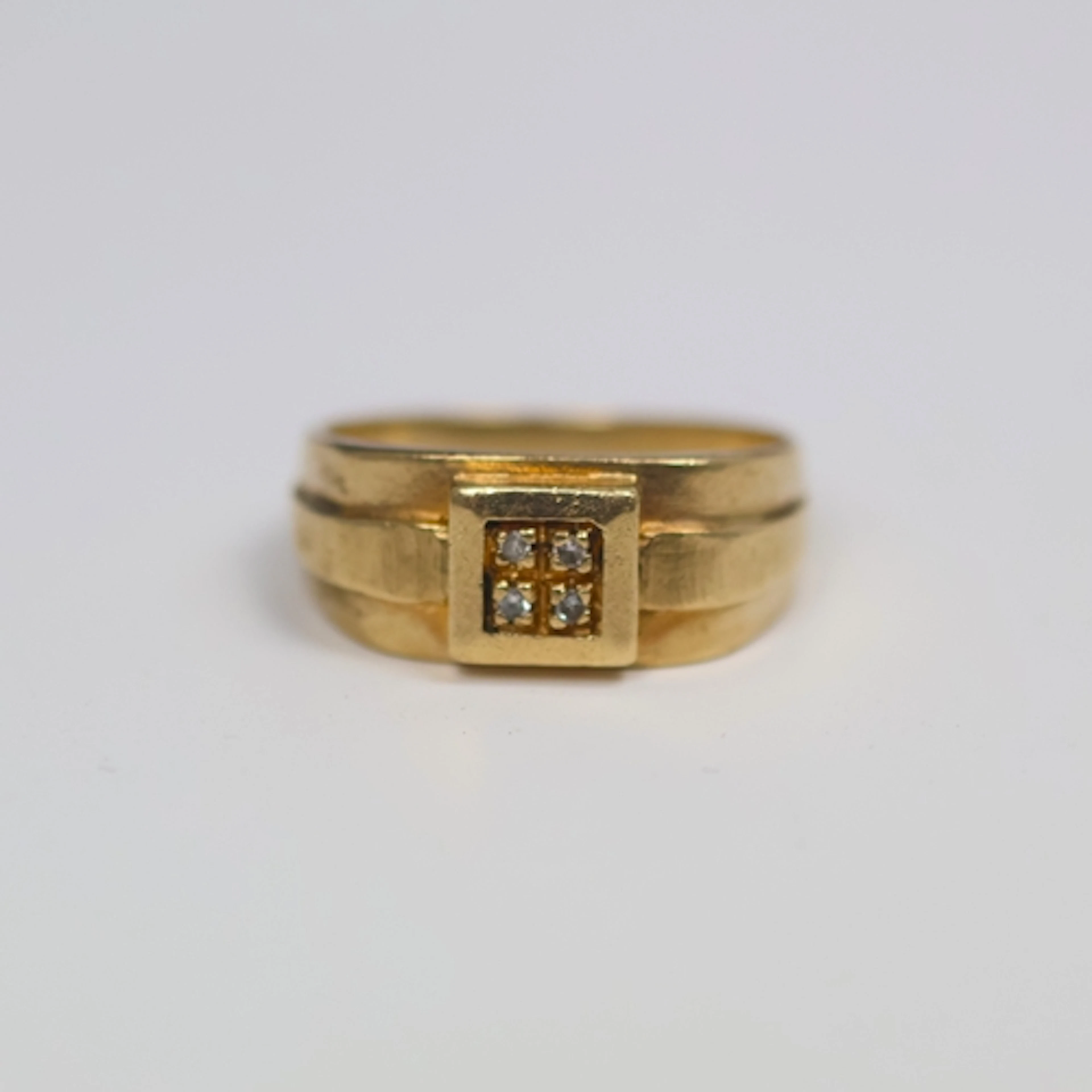 A continental 9ct gold diamond ring, the four round cut diam...