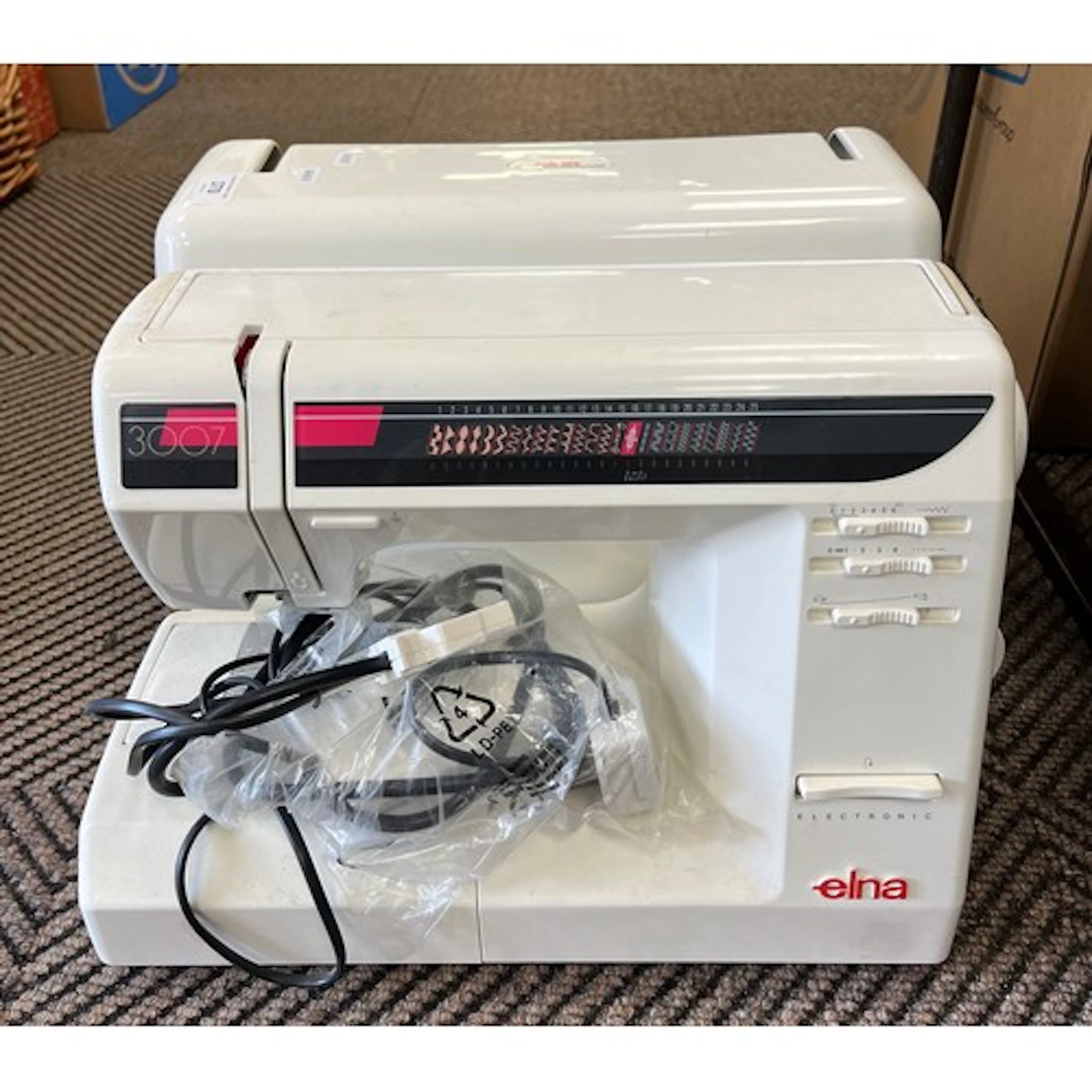 Electric Elna sewing machine with case
