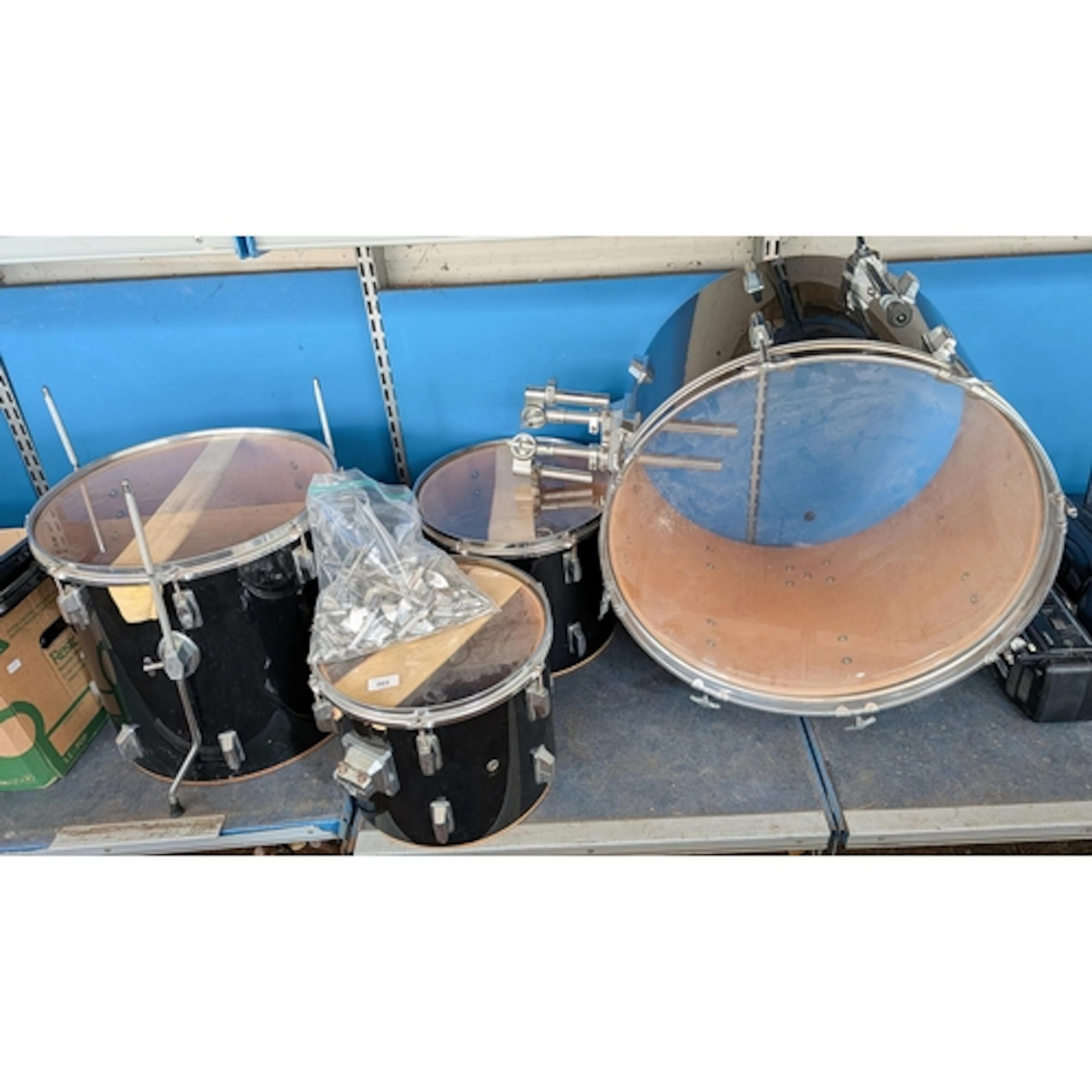 Four assorted sized black and chrome finished drums