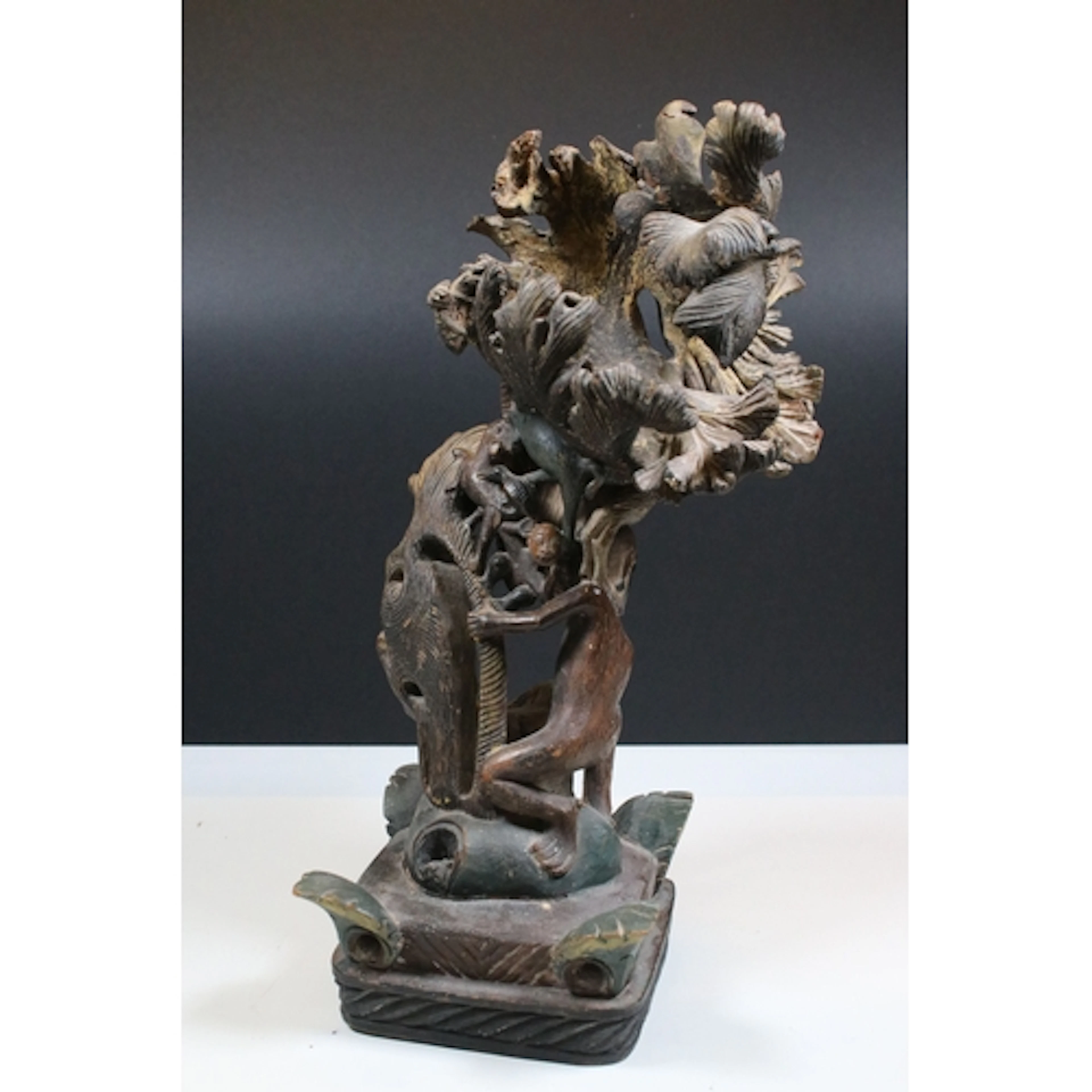 Carved folk art wooden sculpture, possibly African, depictin...