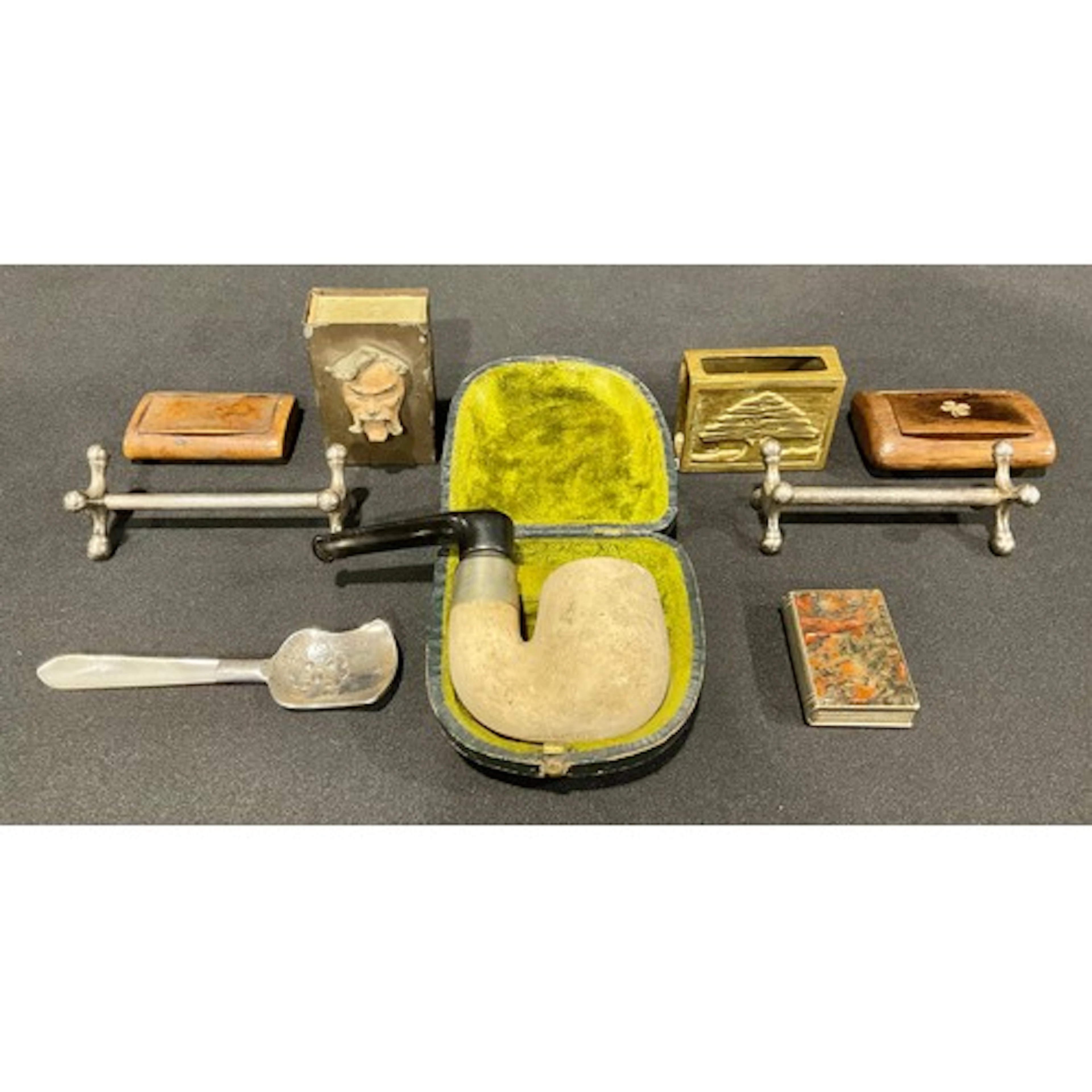A Peterson Brevet cased folding tobacco pipe, 10cm long; an ...