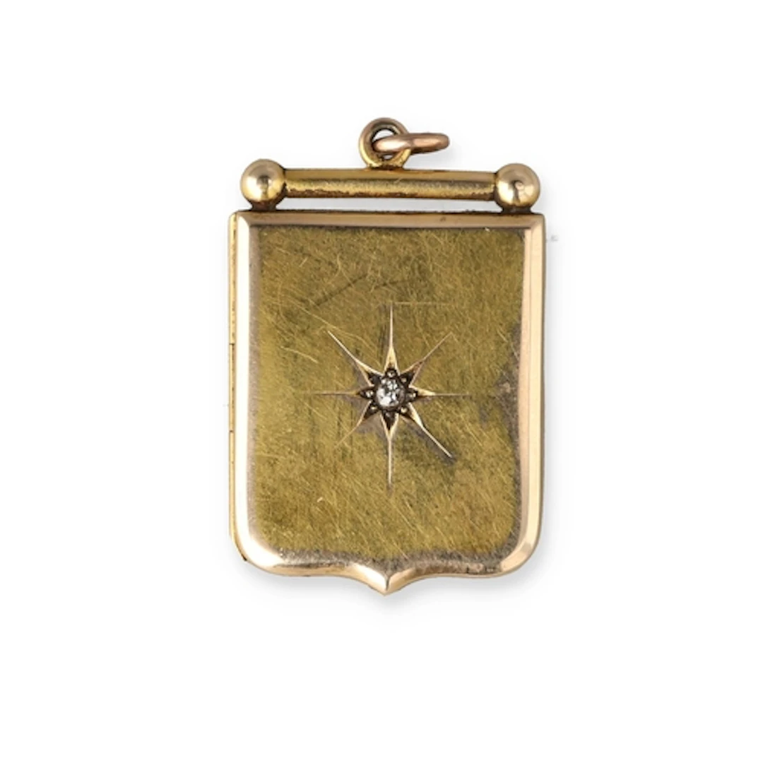 AN ANTIQUE 15CT GOLD LOCKET SET WITH A DIAMOND Weight: 5.8gm...