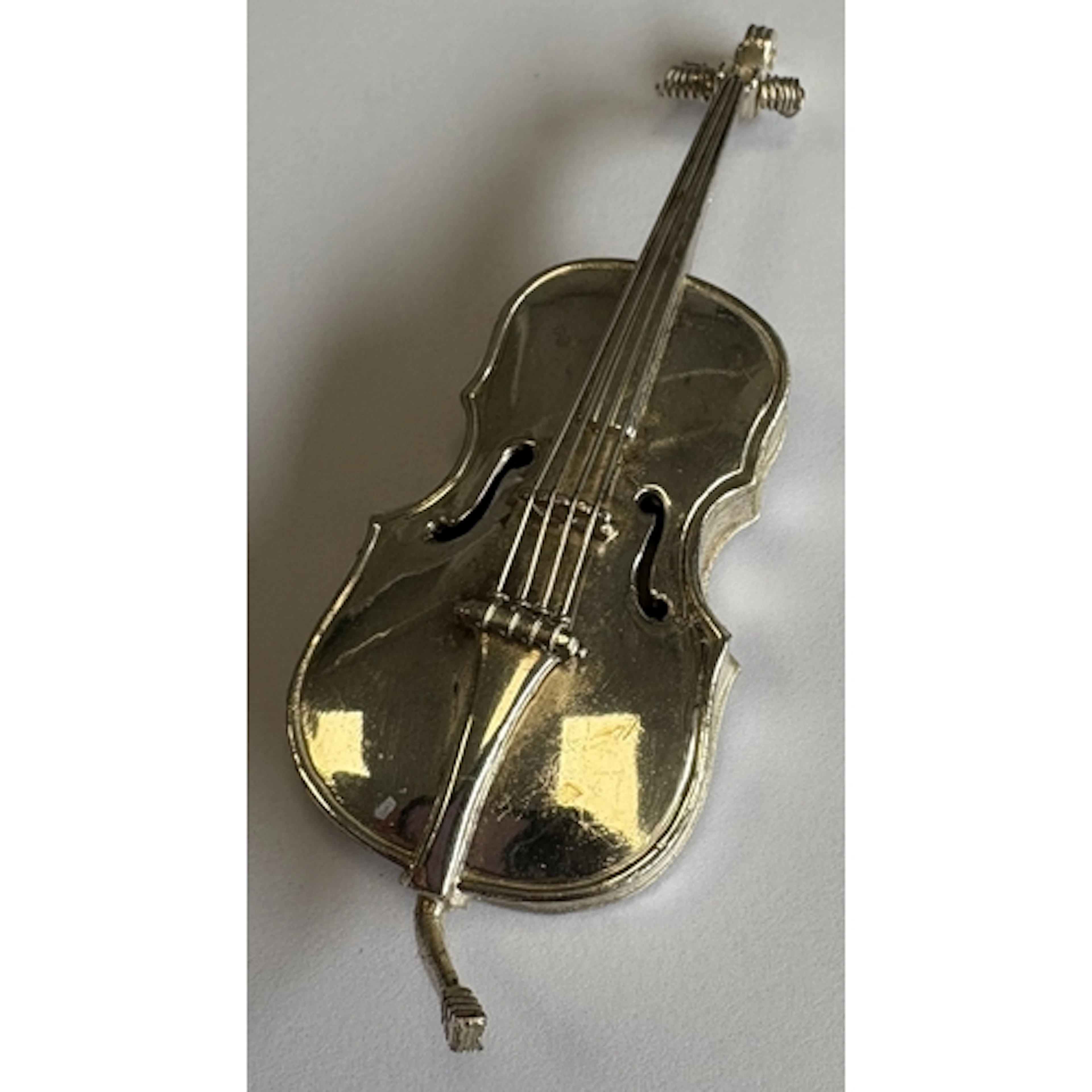 A Continental silver model of a cello. Approx. 39 grams. Est...