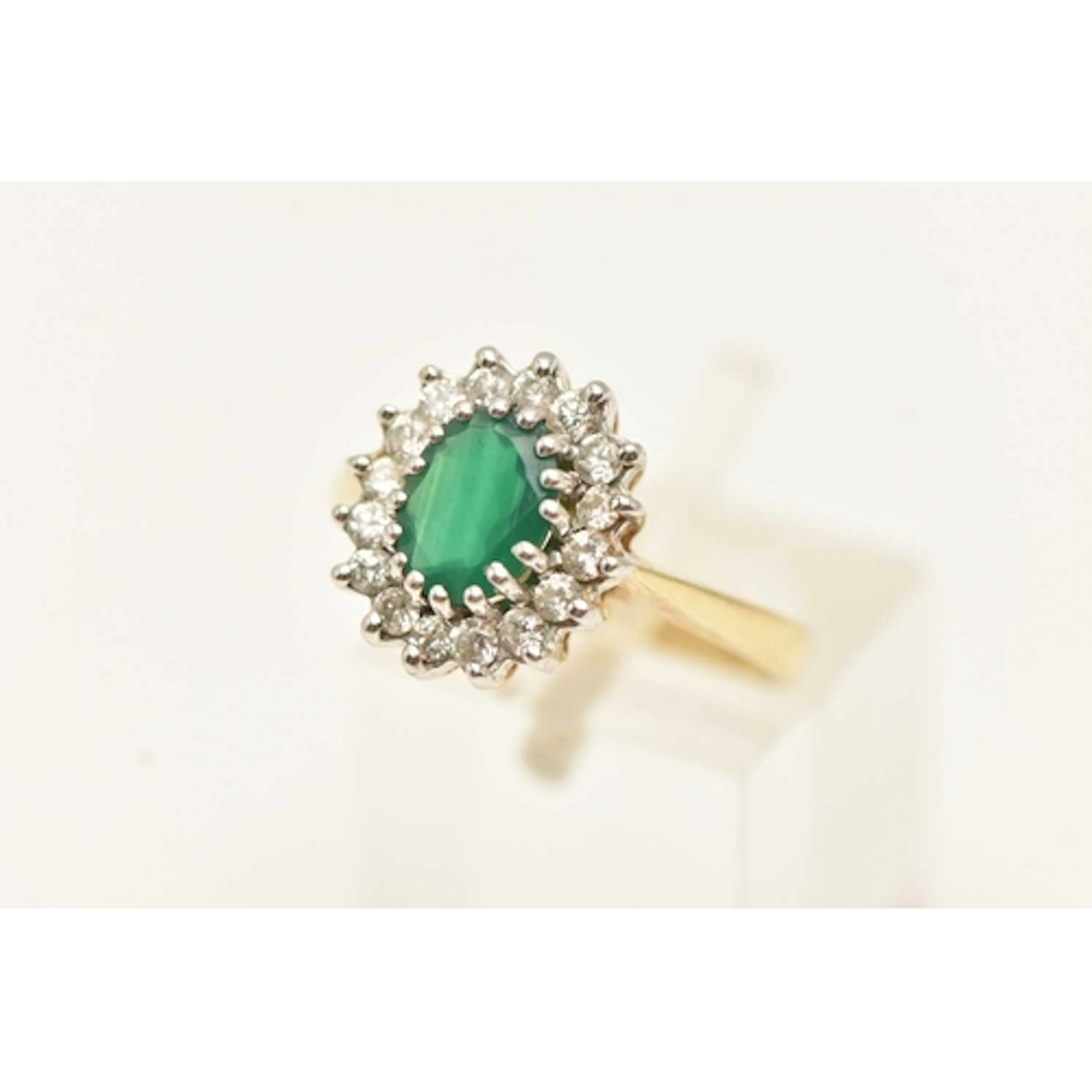 A 9CT YELLOW GOLD GEM SET RING. an oval cut chalcedony, set ...