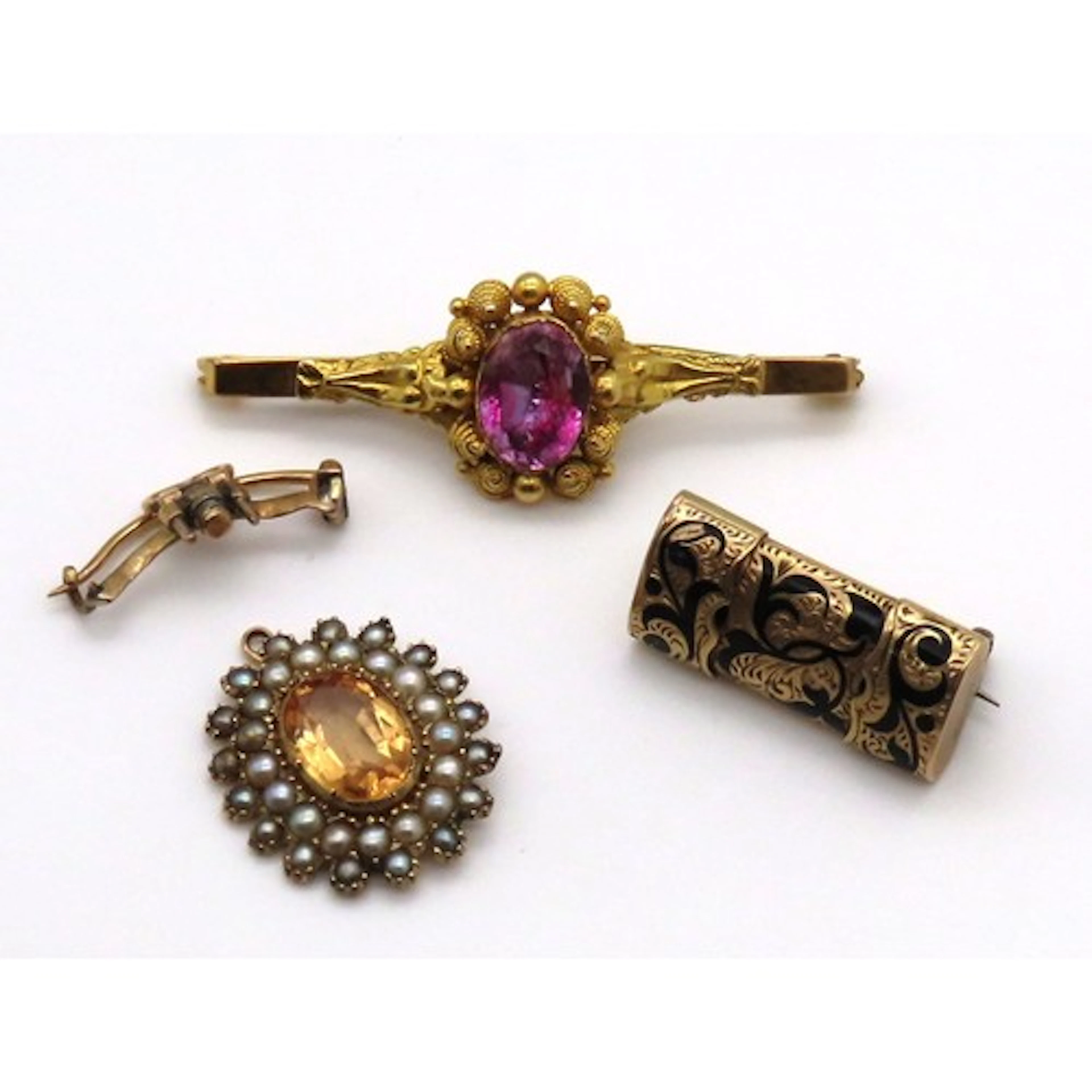 An early 20th century brooch, centred with an oval mixed-cut...
