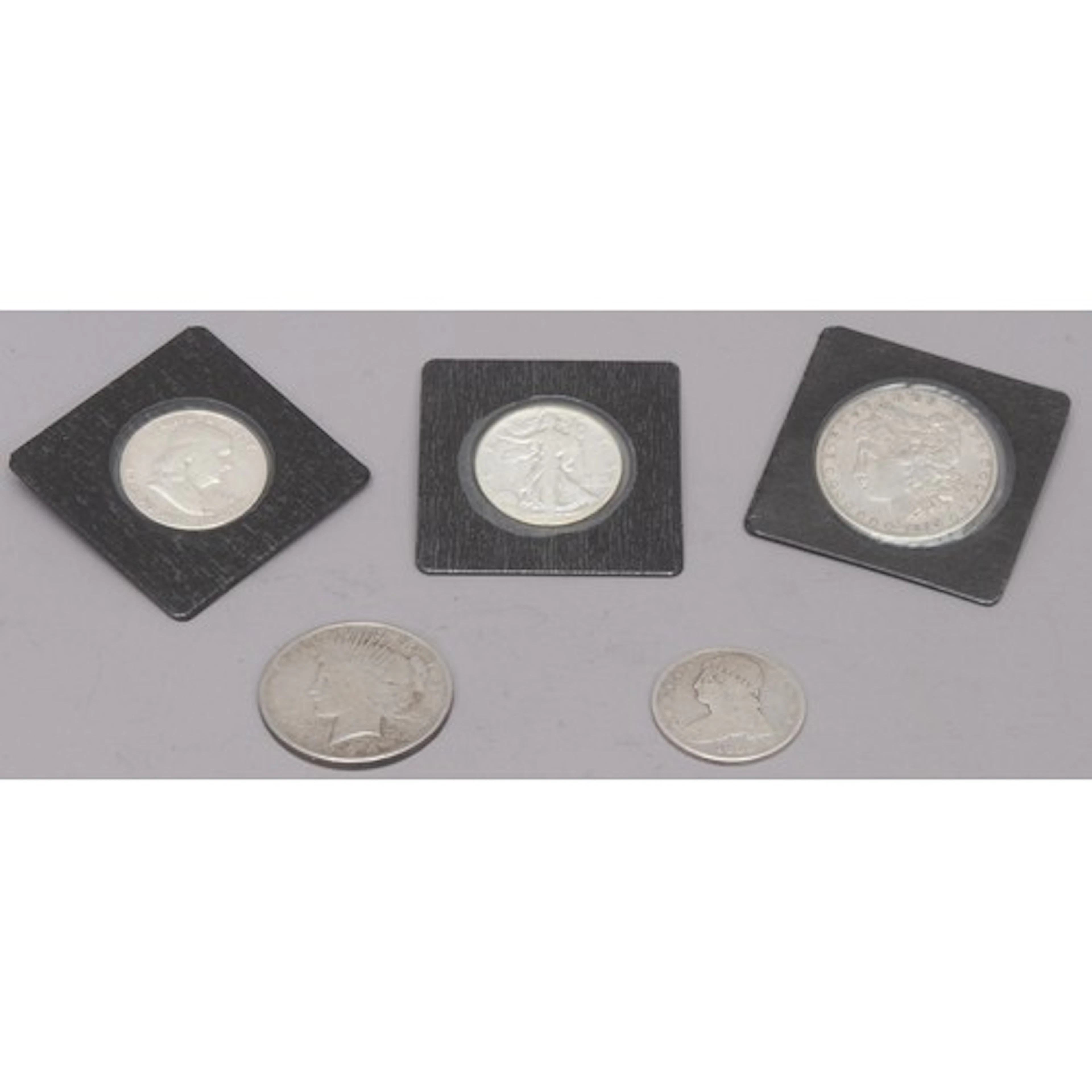 Coins - USA - an American Morgan silver dollar, 1899; a Benj...
