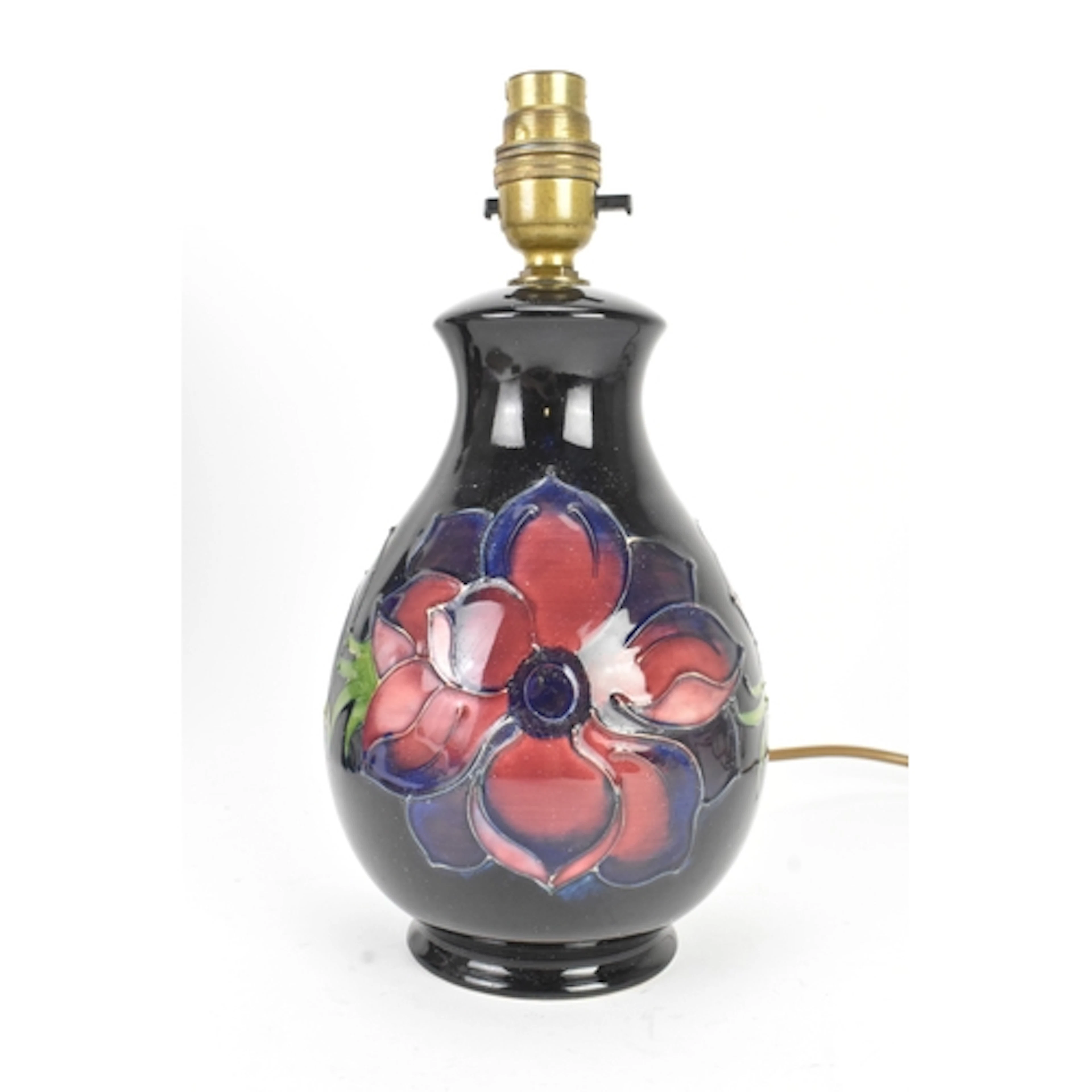 A Moorcroft pottery table lamp, decorated in the Anemone pat...