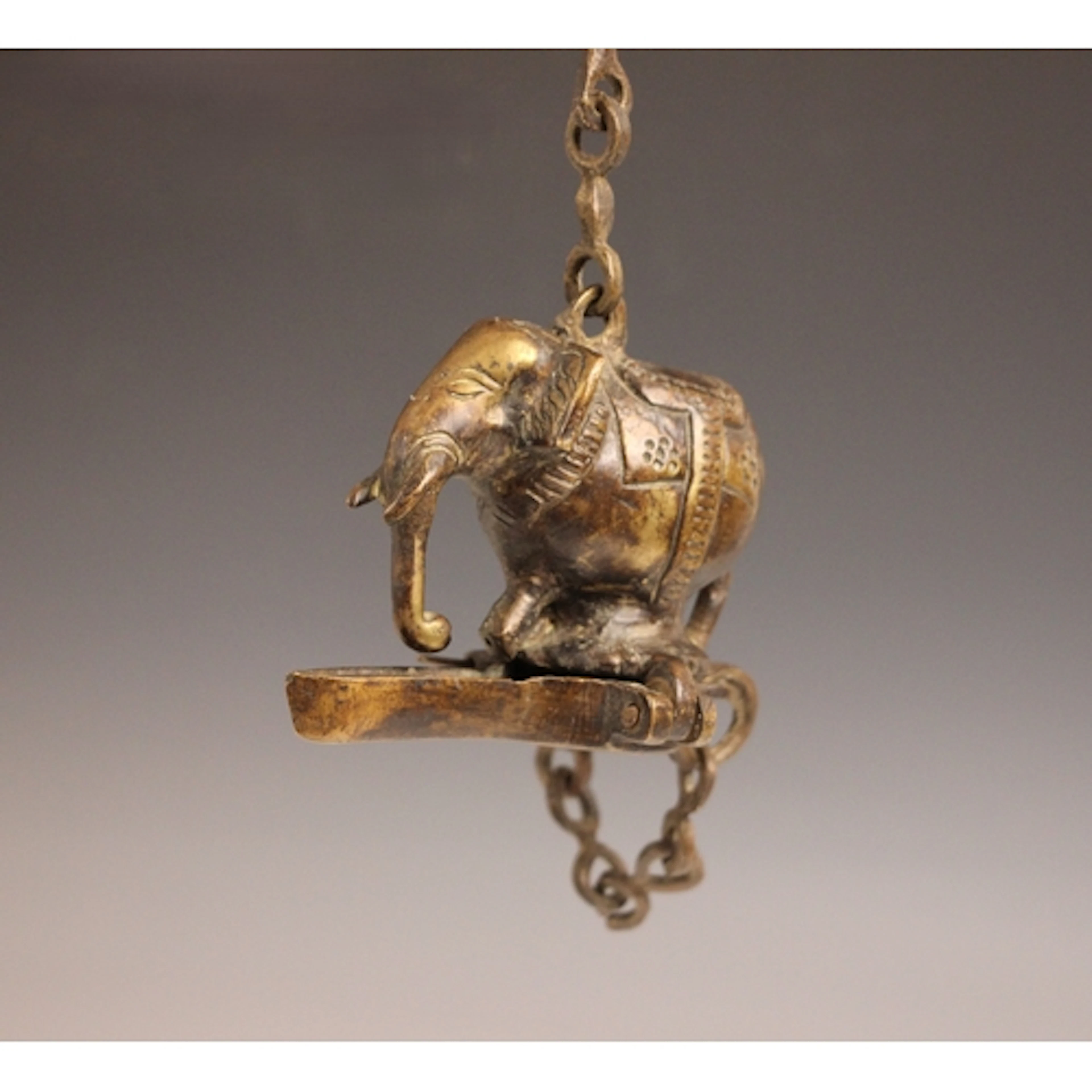 An Indian bronze hanging Diya lamp in the form of an elephan...