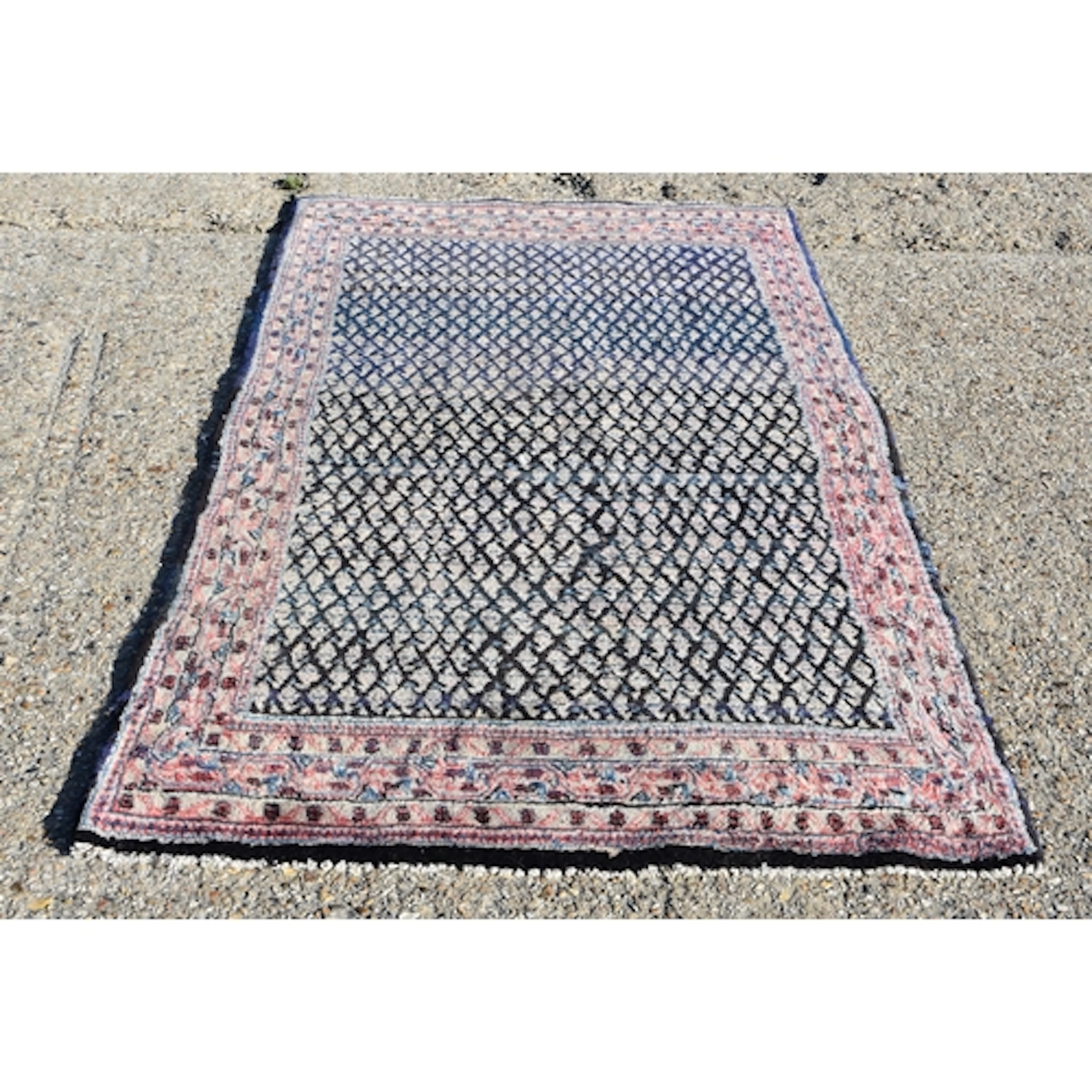 A hand knotted Persian rug 230 x 110cm
