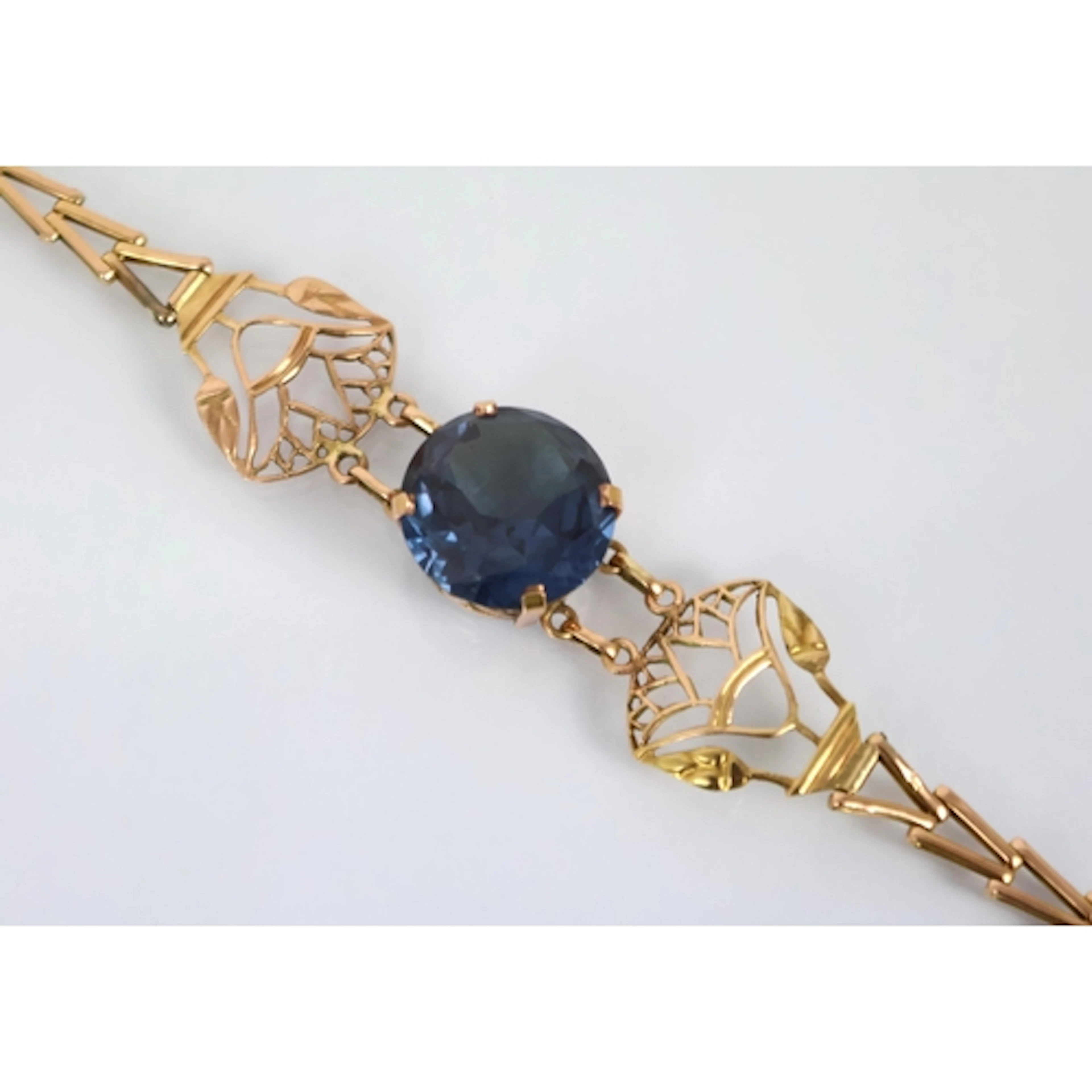 A synthetic alexandrite set bracelet, the central circular s...