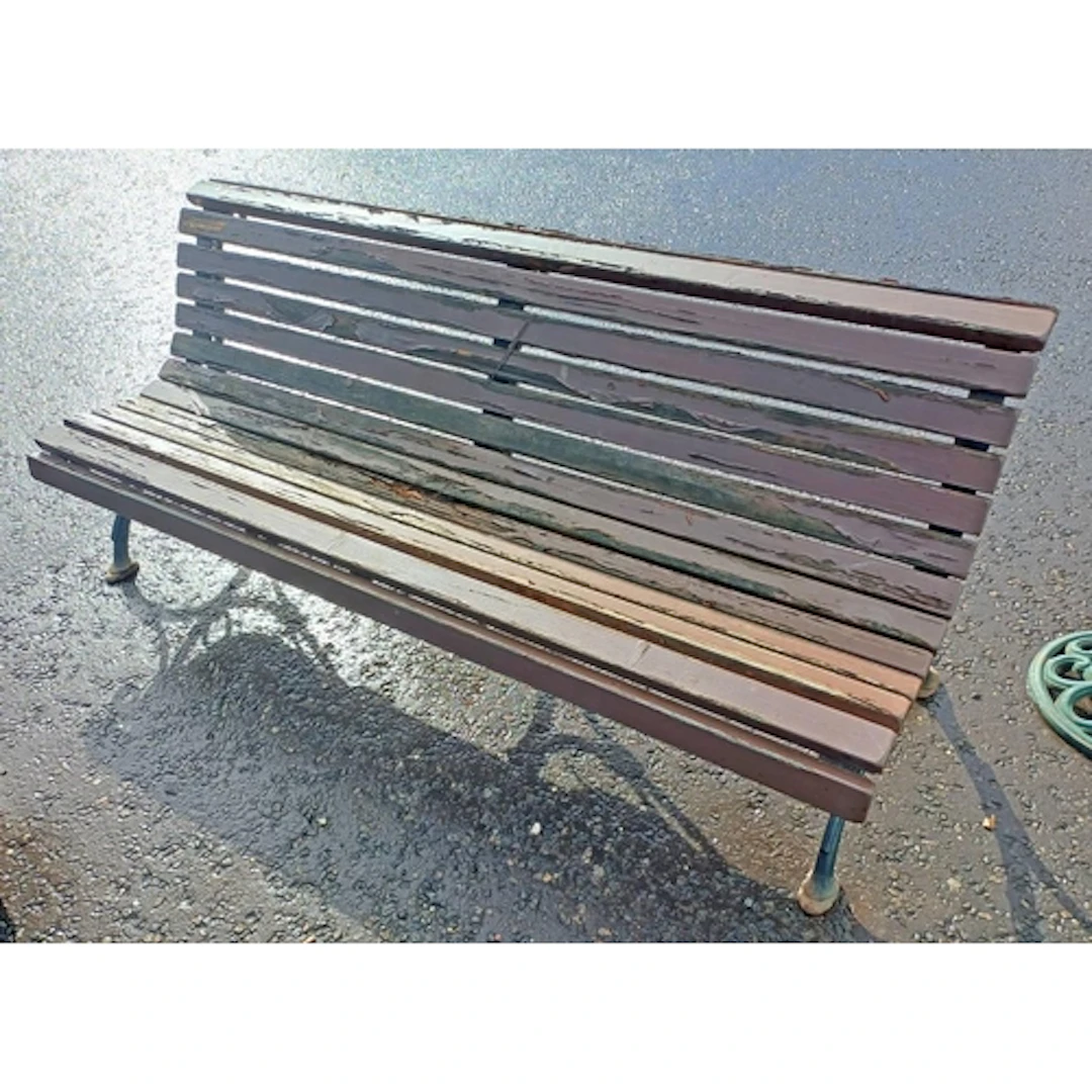 WOODEN GARDEN BENCH ON PAINTED CAST METAL SUPPORTS