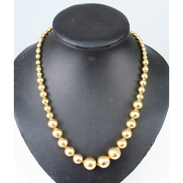 An Italian 14K gold graduated bead necklace interspersed wit...