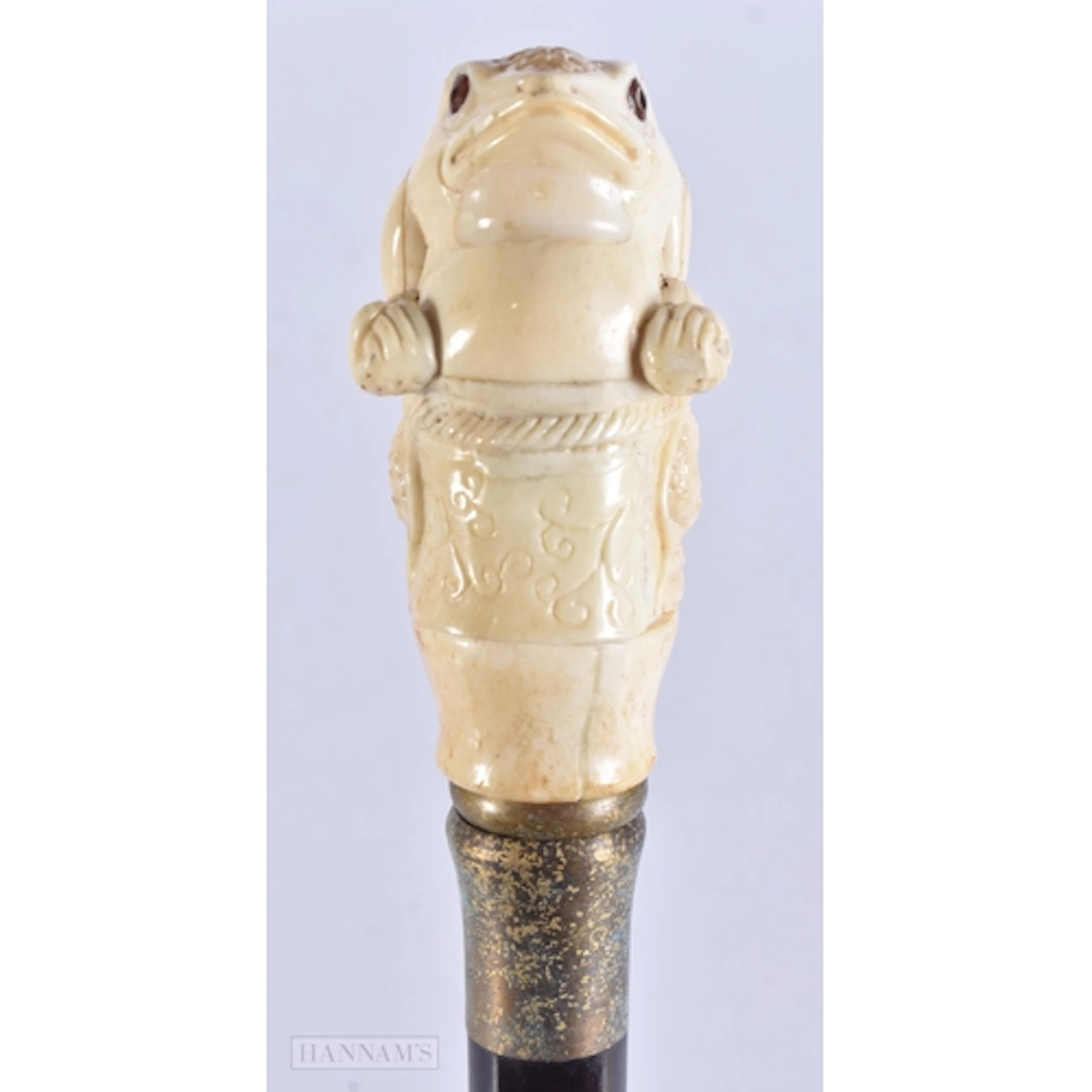 A CARVED BONE WALKING CANE. 90 cm long.