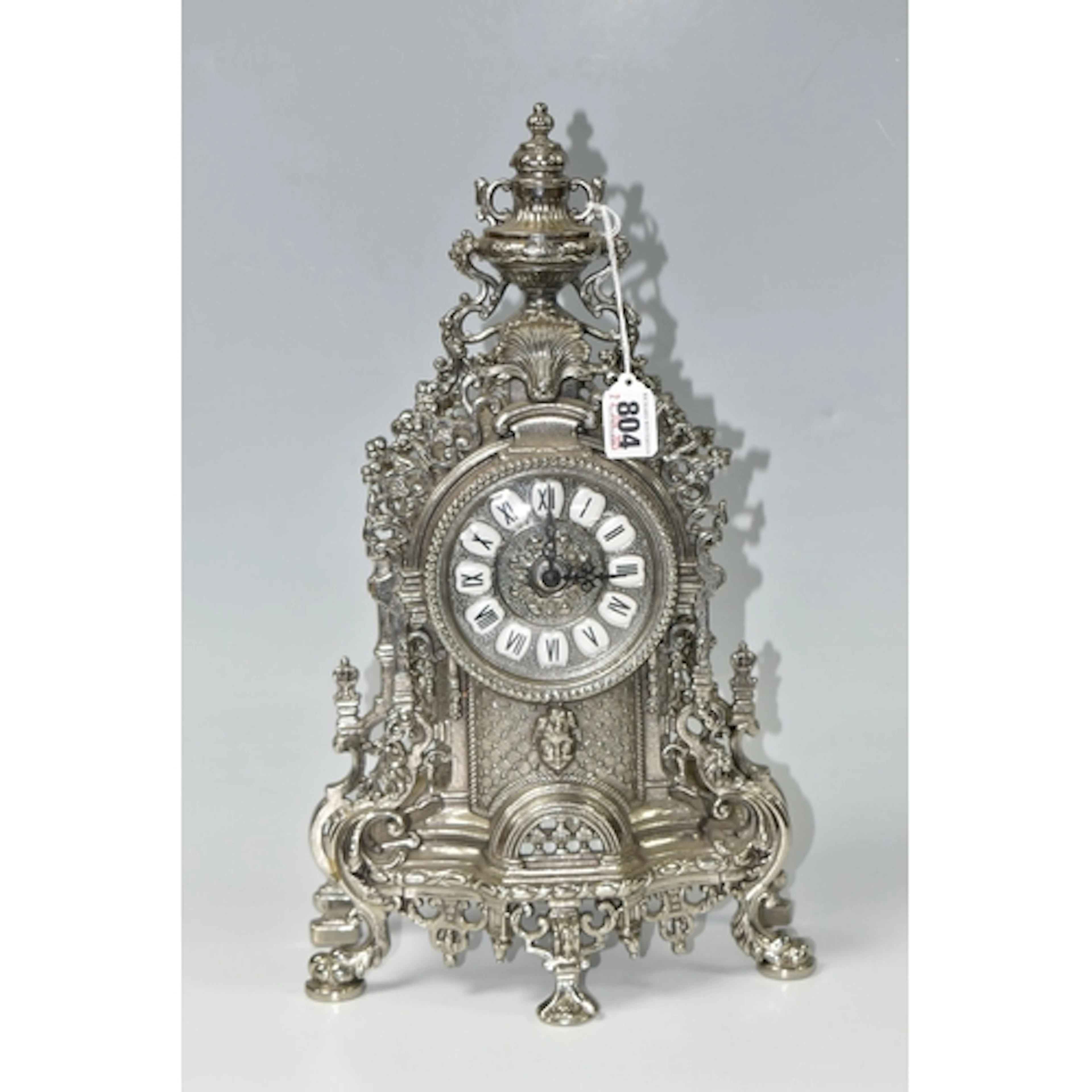 A MODERN ITALIAN MANTEL CLOCK, battery operated, metal case,...