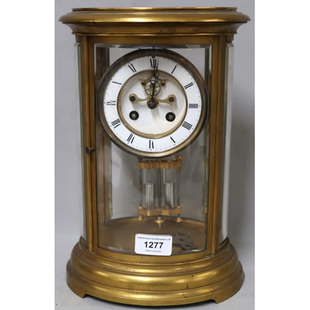Late 19th Century oval gilt brass four glass library clock, ...