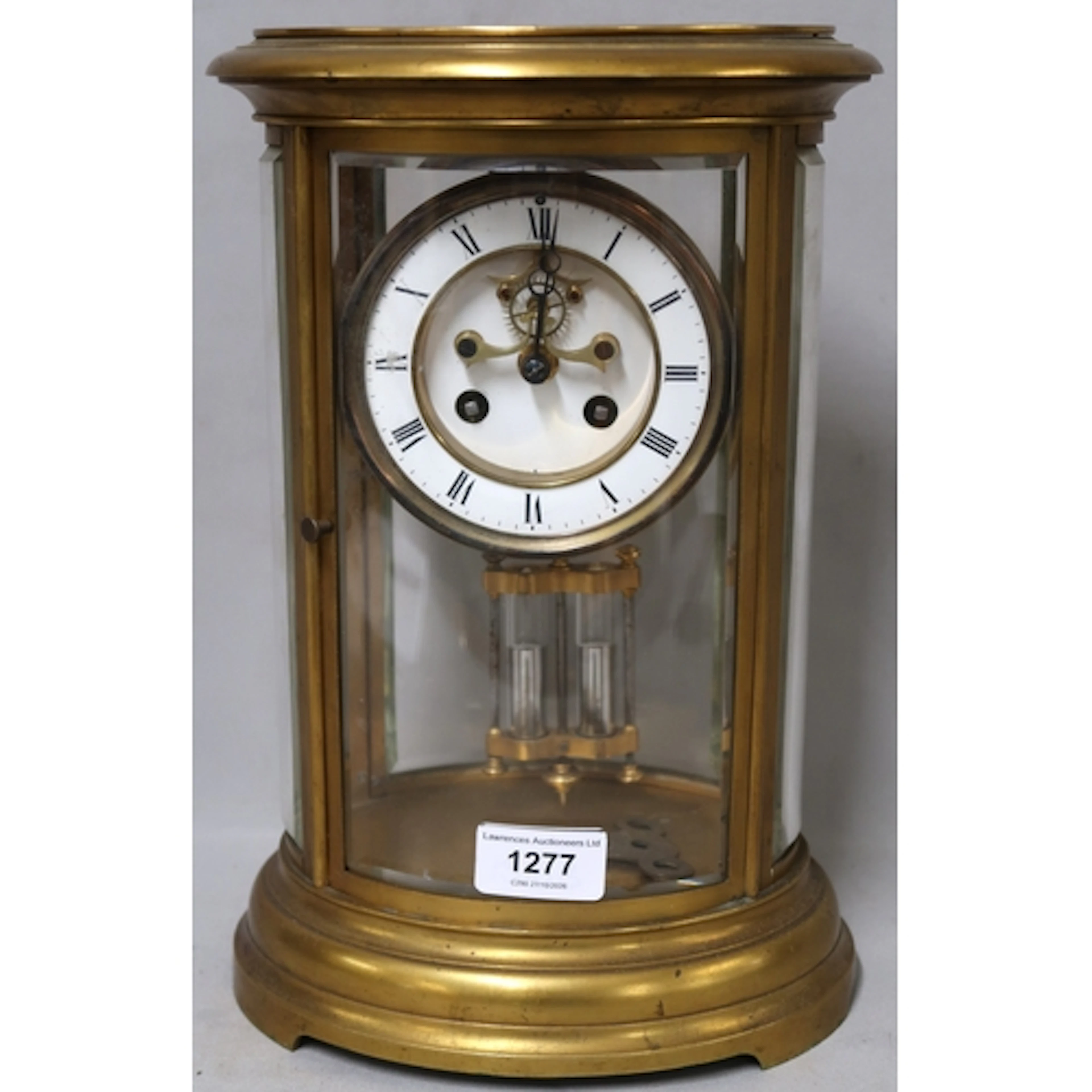 Late 19th Century oval gilt brass four glass library clock, ...