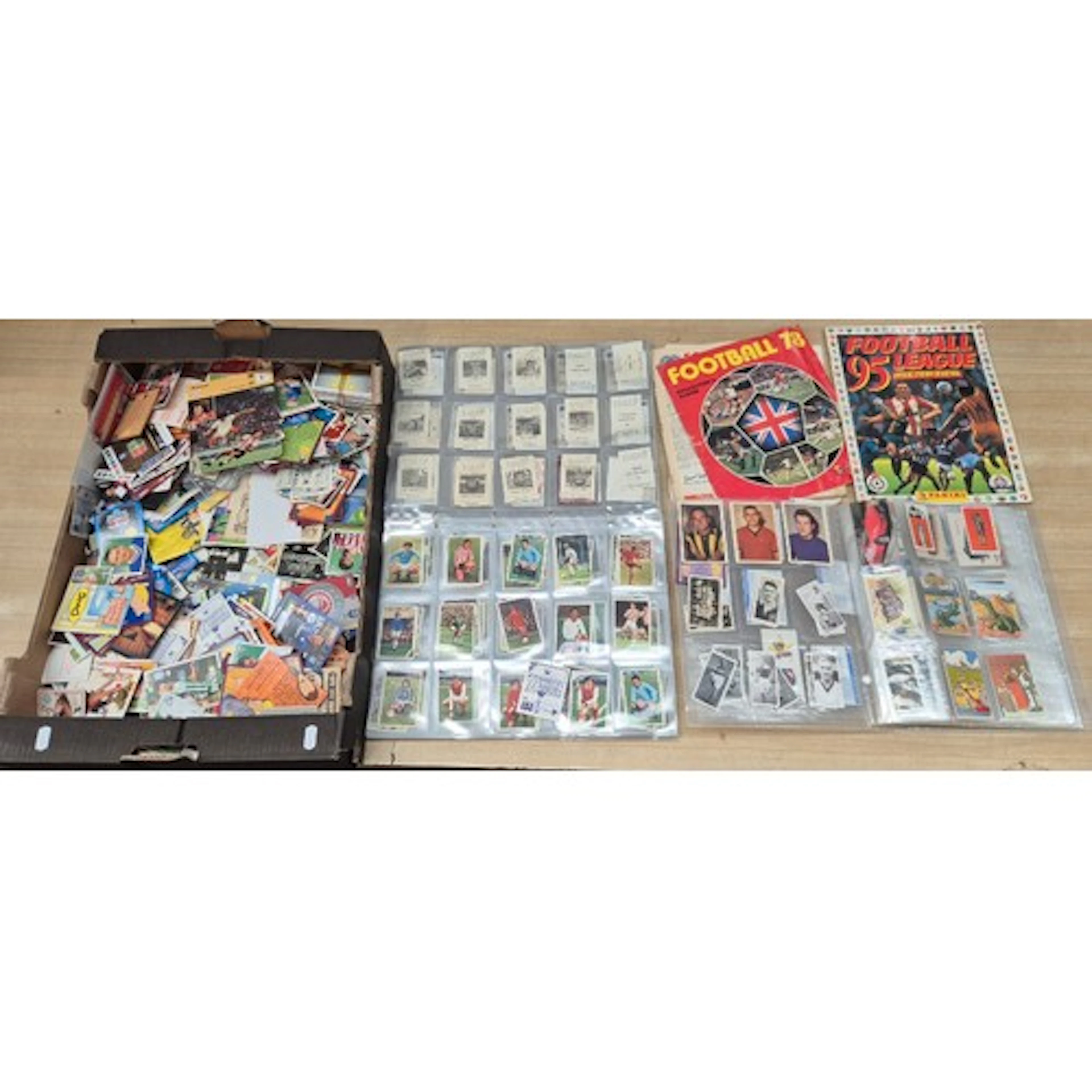 A box of assorted football collector cards.