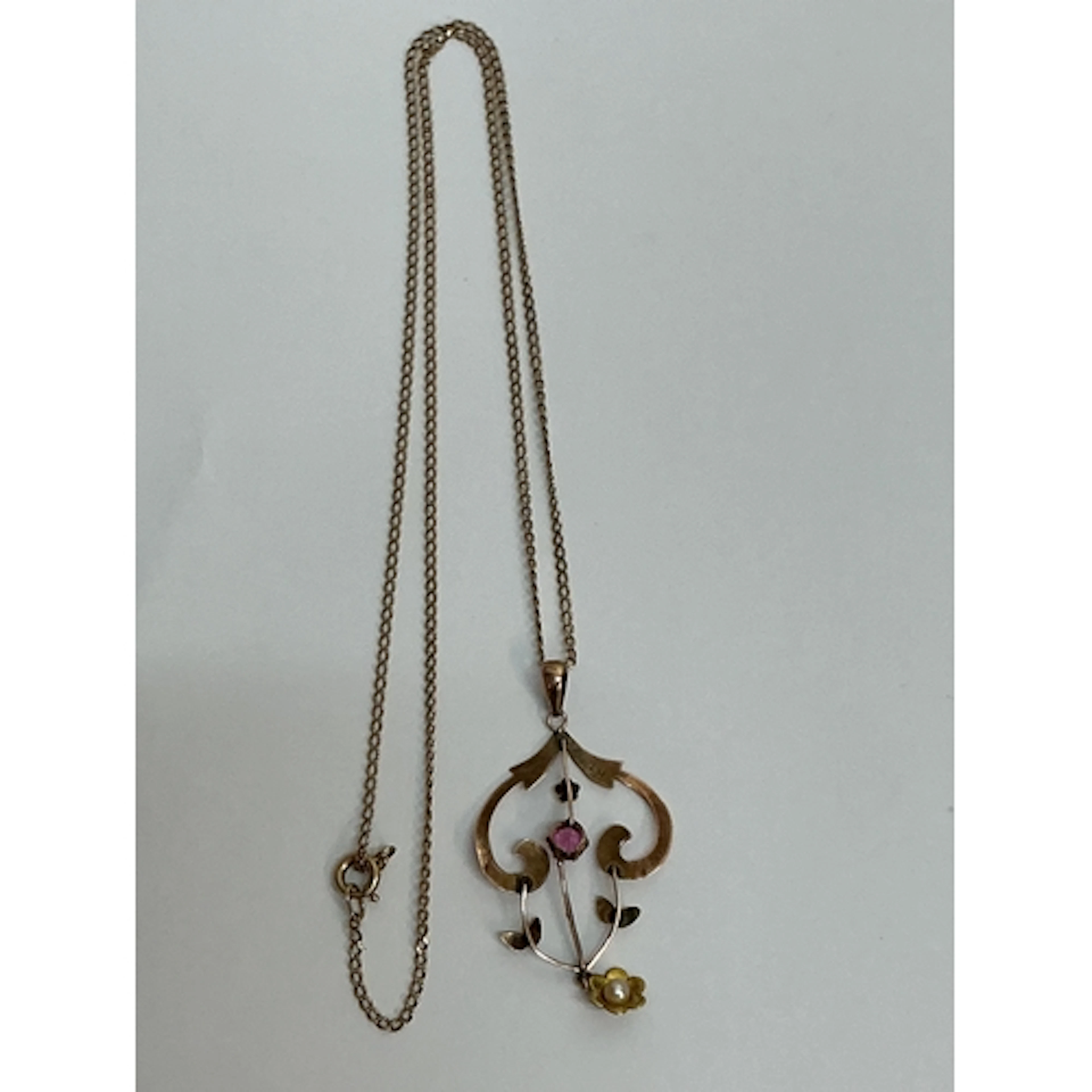 A 9ct gold Edwardian style pendant necklace set with a small...