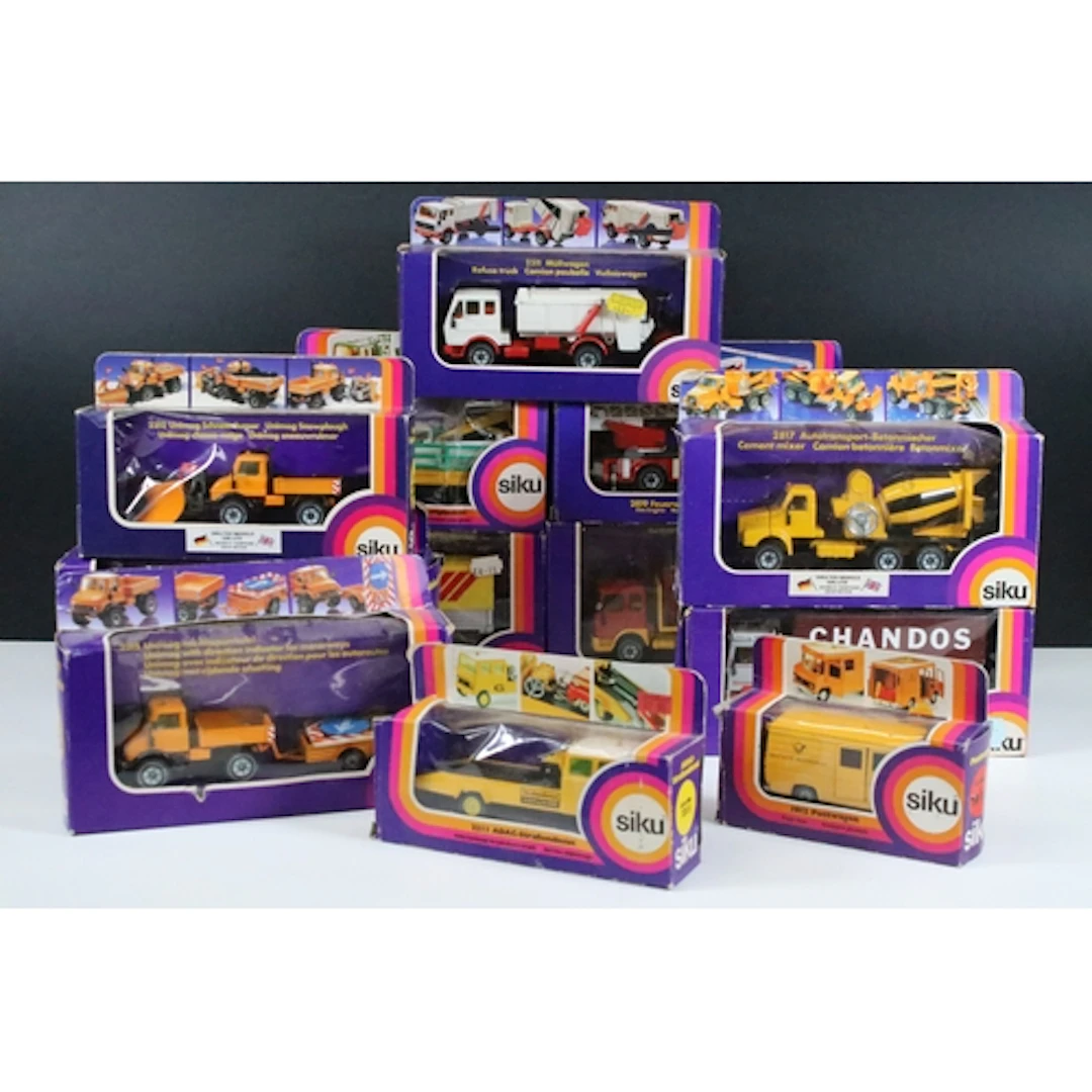 12 Boxed Siku commercial related diecast models to include 2...