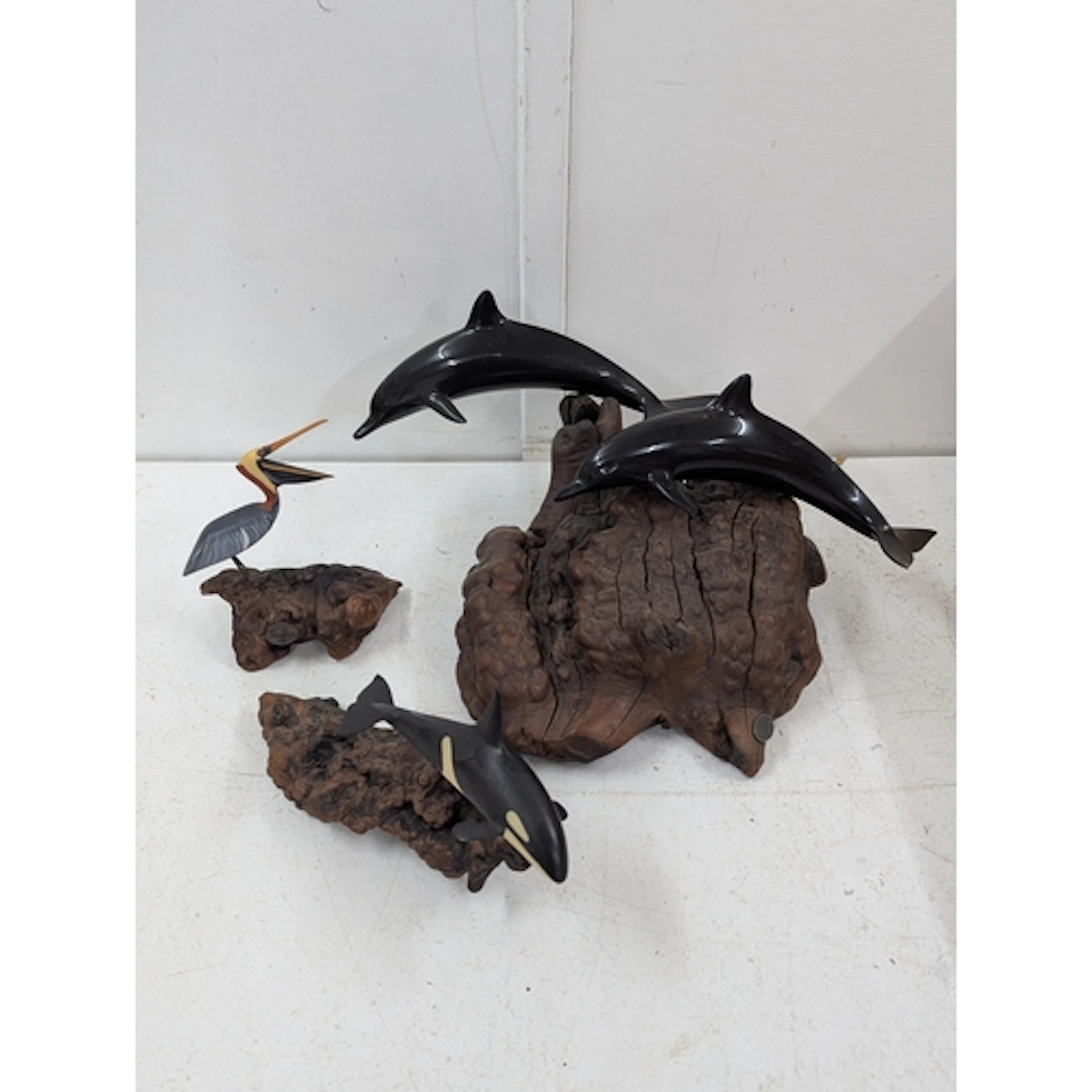 Three John Perry sculptures to include dolphin duo, pelican ...