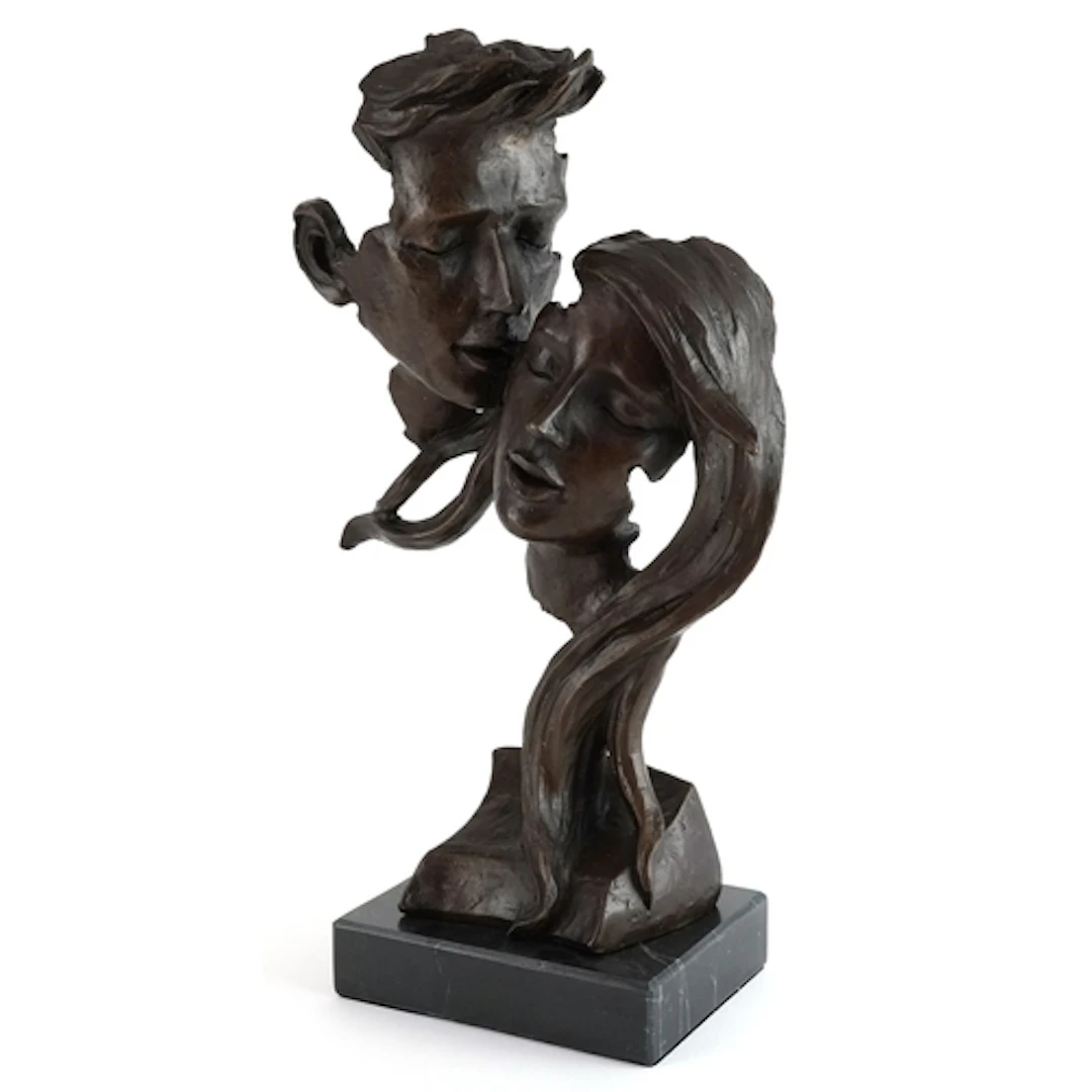 Patinated bronze sculpture of a loving couple raised on a bl...