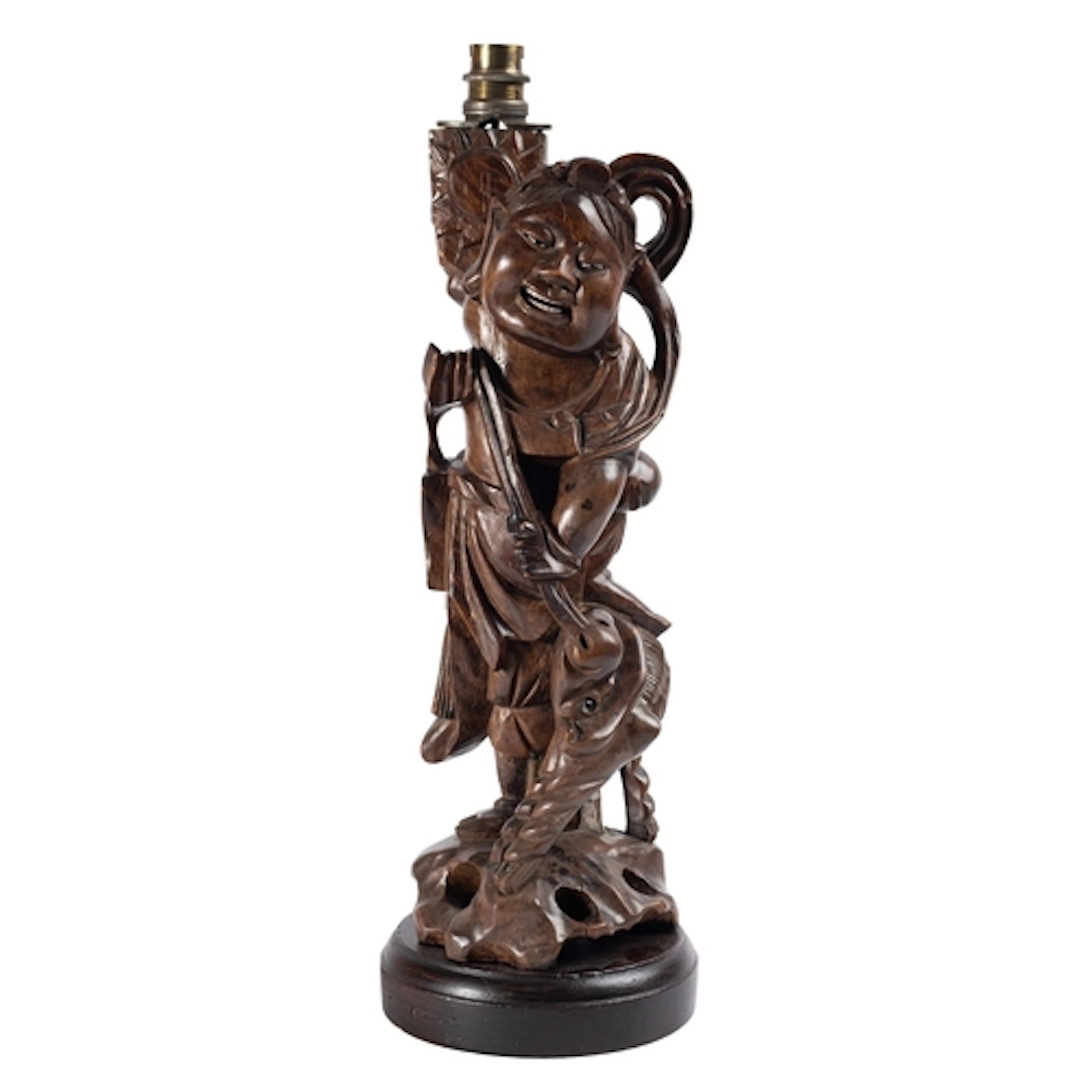 A Chinese carved hardwood wood figure leading a mythical bea...