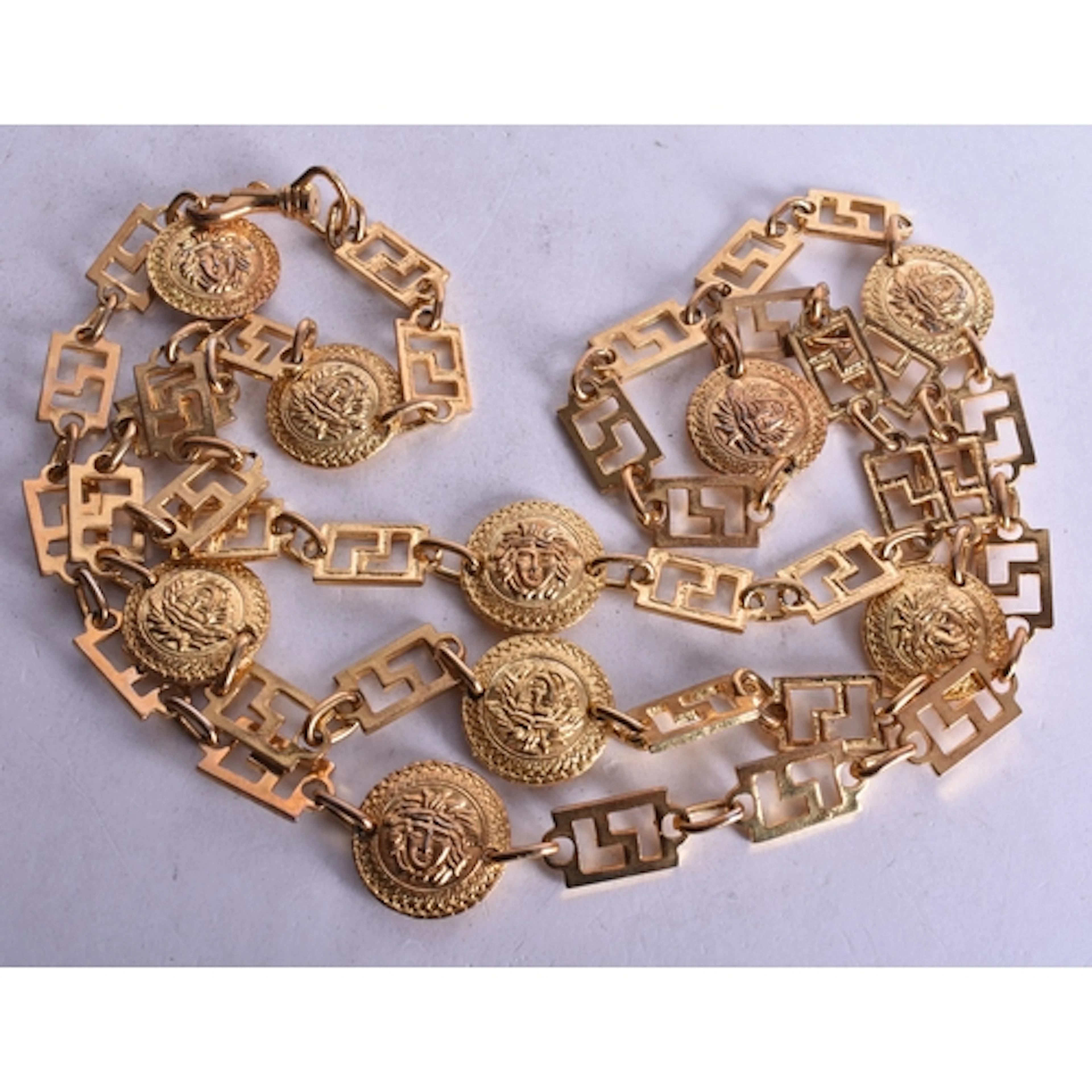 A Versace Style Gold Tone Medusa Head Coin and Greek Key Lin...
