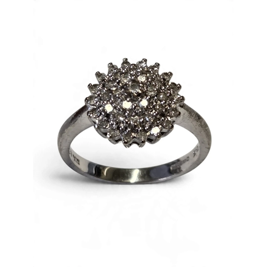 An attractive 9-carat gold and white gold diamond cluster ri...