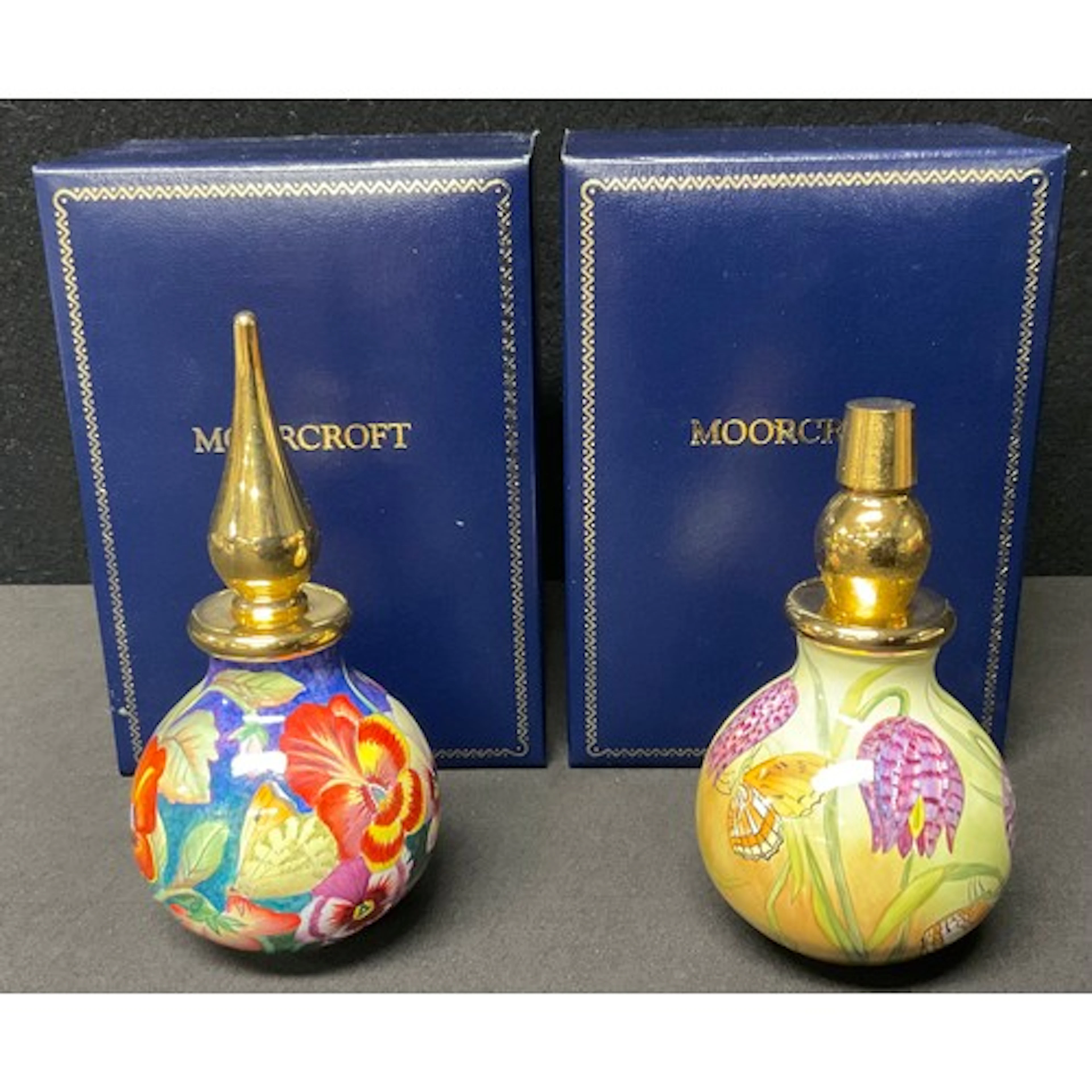 A Moorcroft enamels hand decorated scent bottle painted wit...