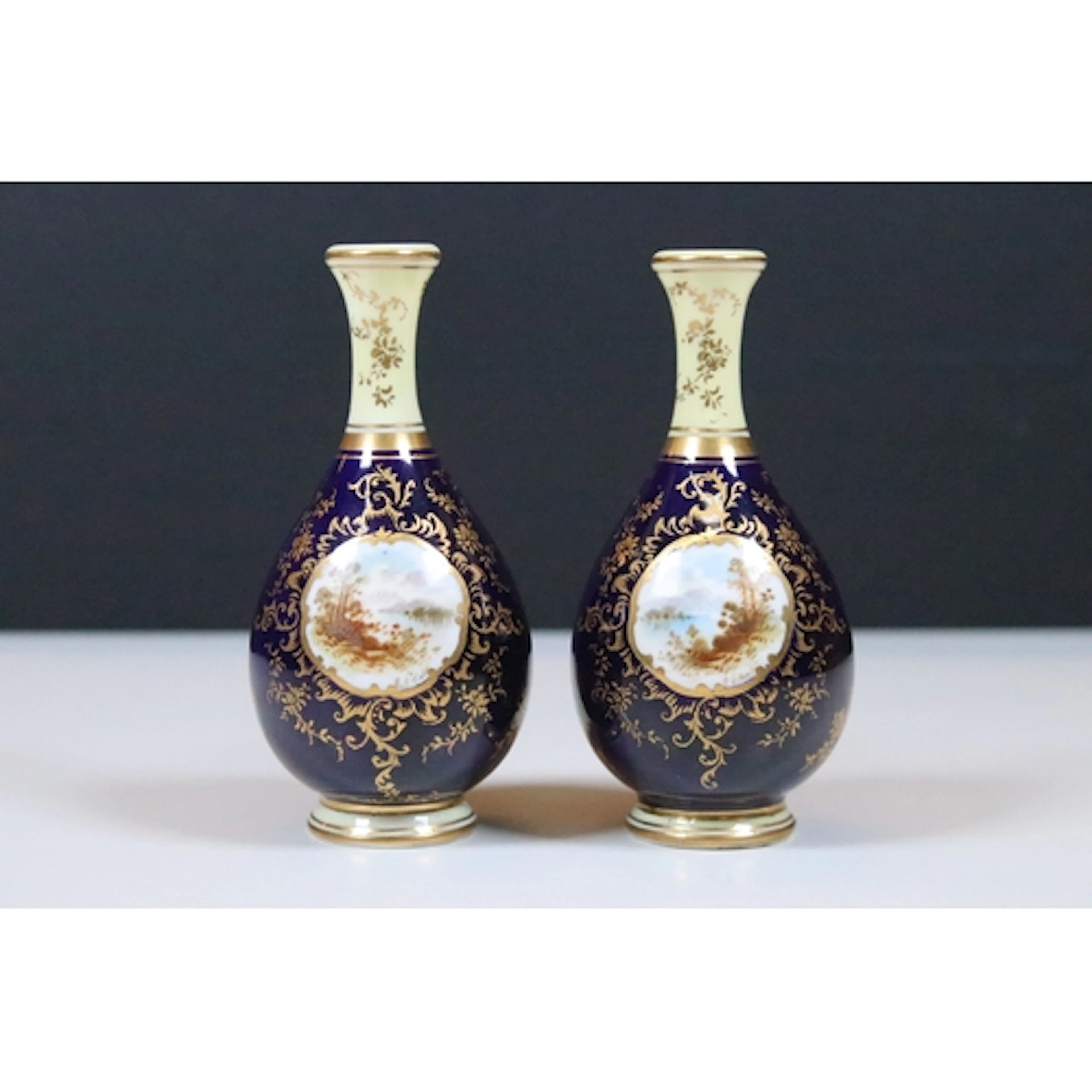 Pair of miniature Coalport porcelain bottles vases, decorate...