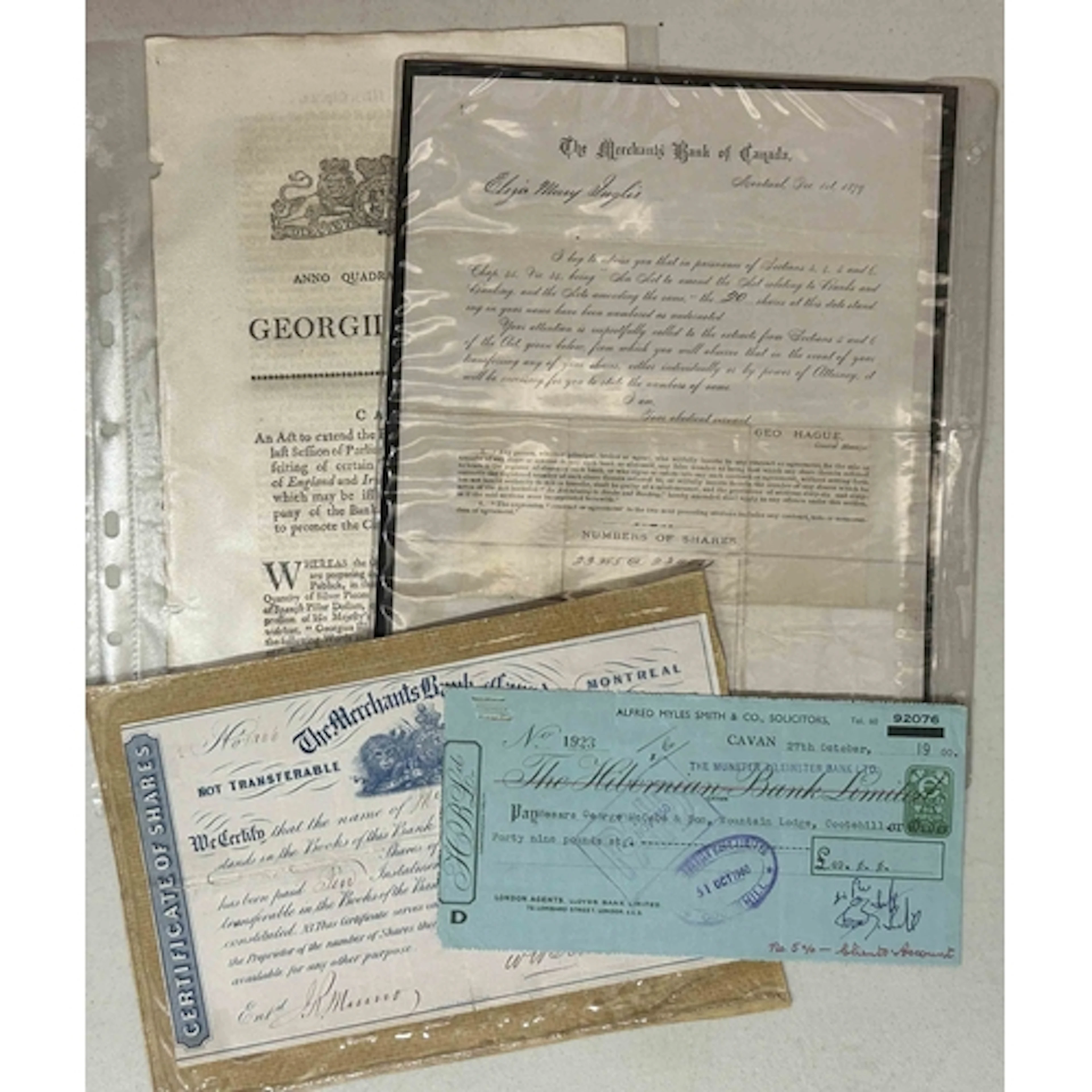 A collection of cheques, banknotes and banking ephemera hous...