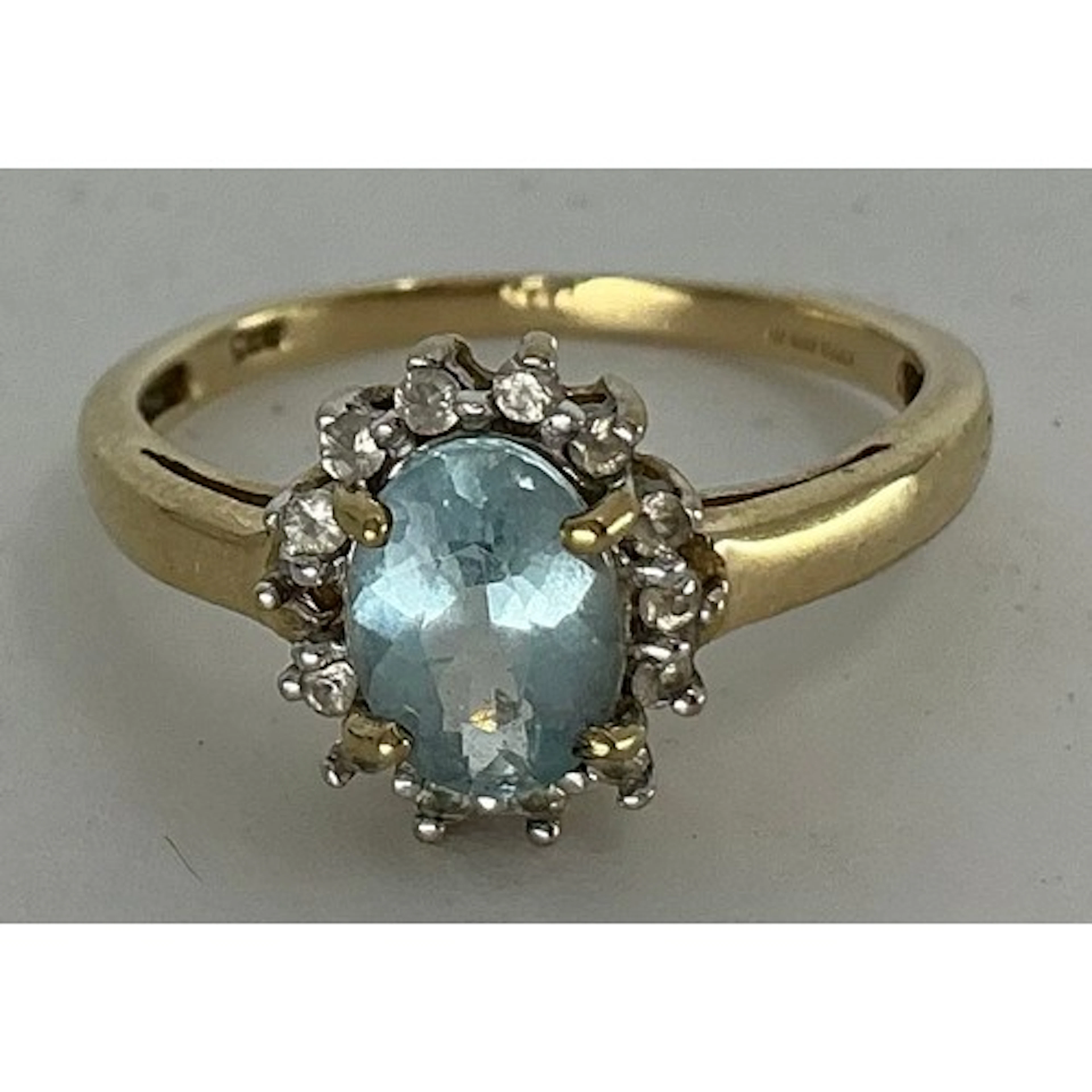 A pale blue aquamarine and Cz 9ct gold ring, size K, Birming...