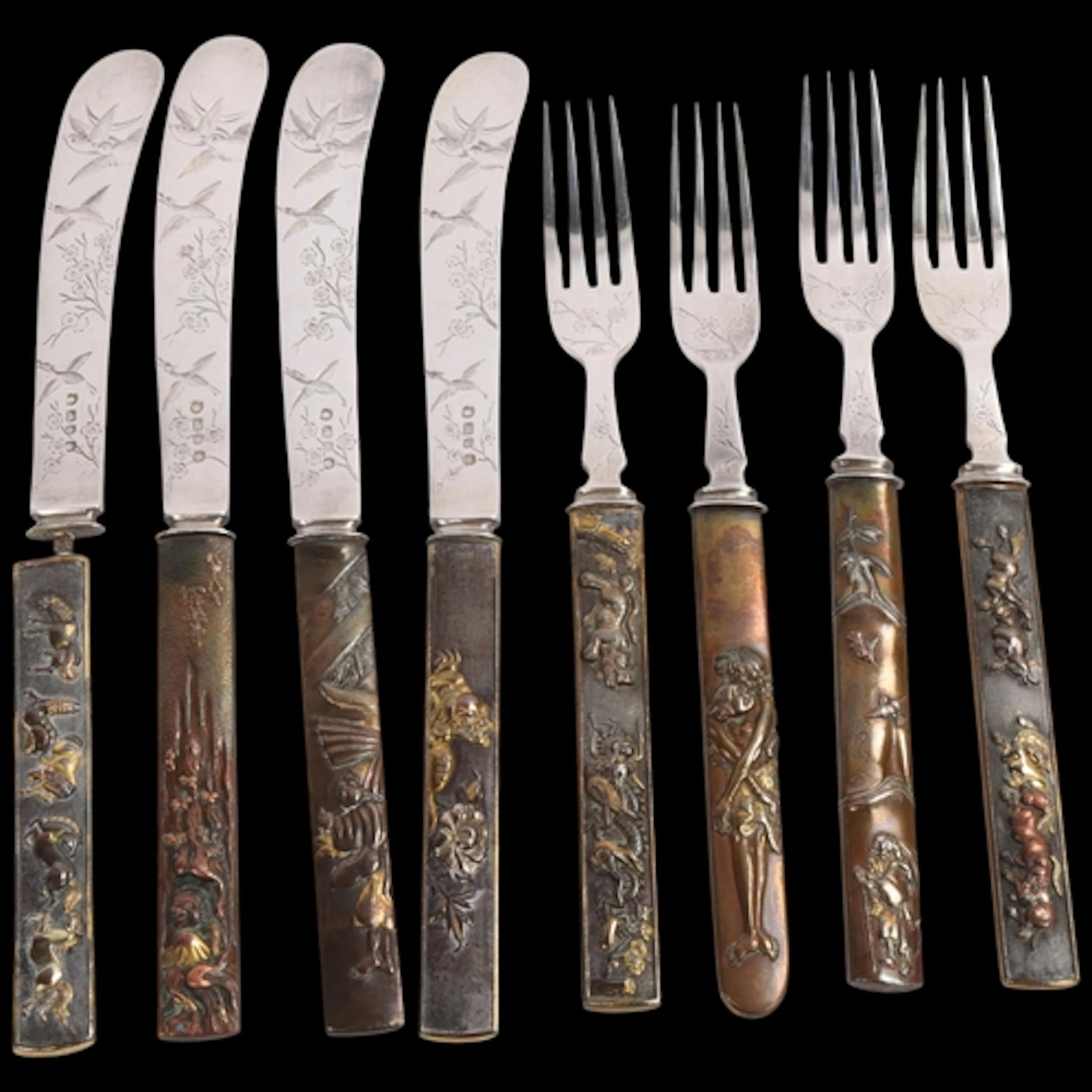 A group of 8 Japanese mixed metal Kozuka, mounted as 4 desse...