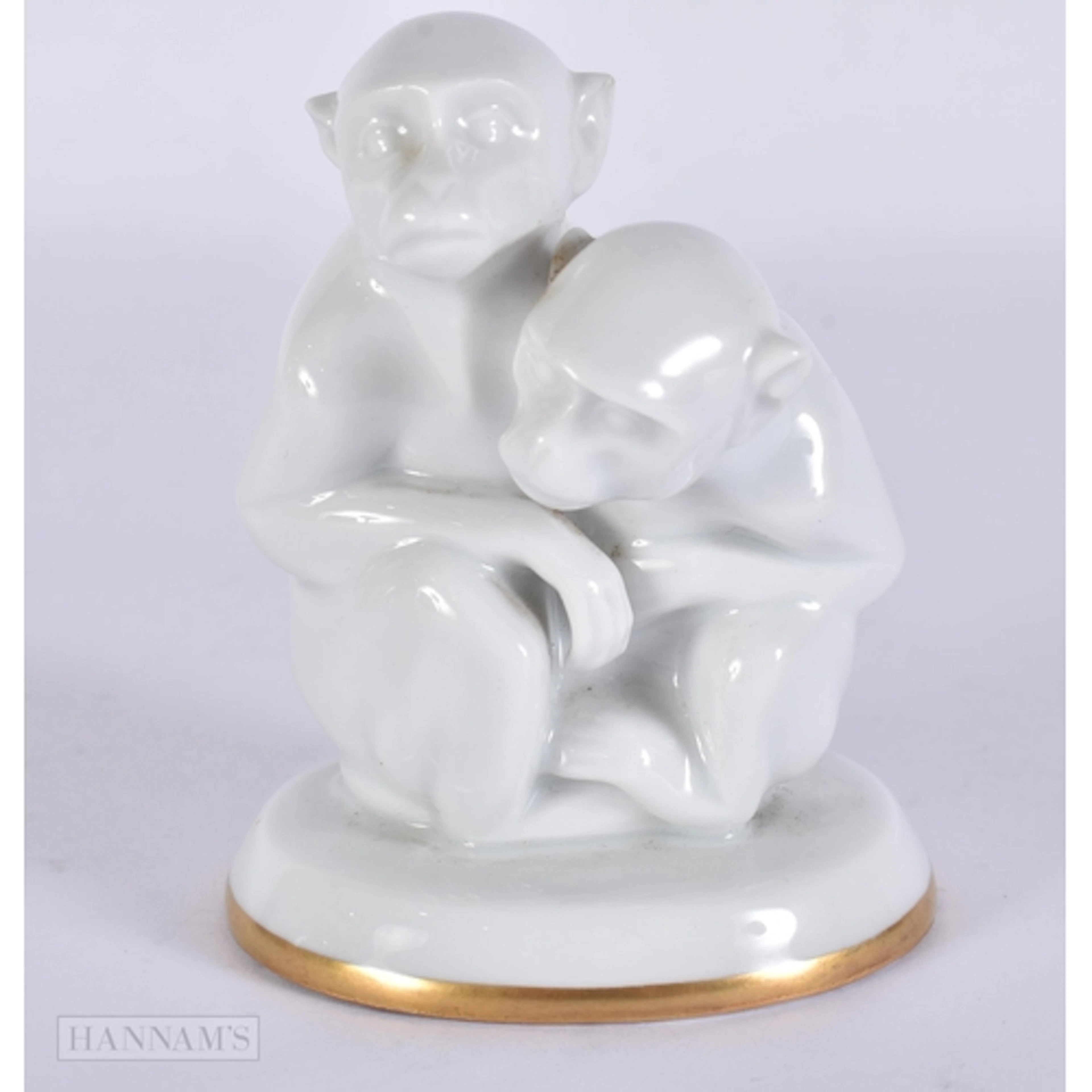 A HUTSCHENREUTHER LORENZ PORCELAIN MONKEY. 8.75 cm high.