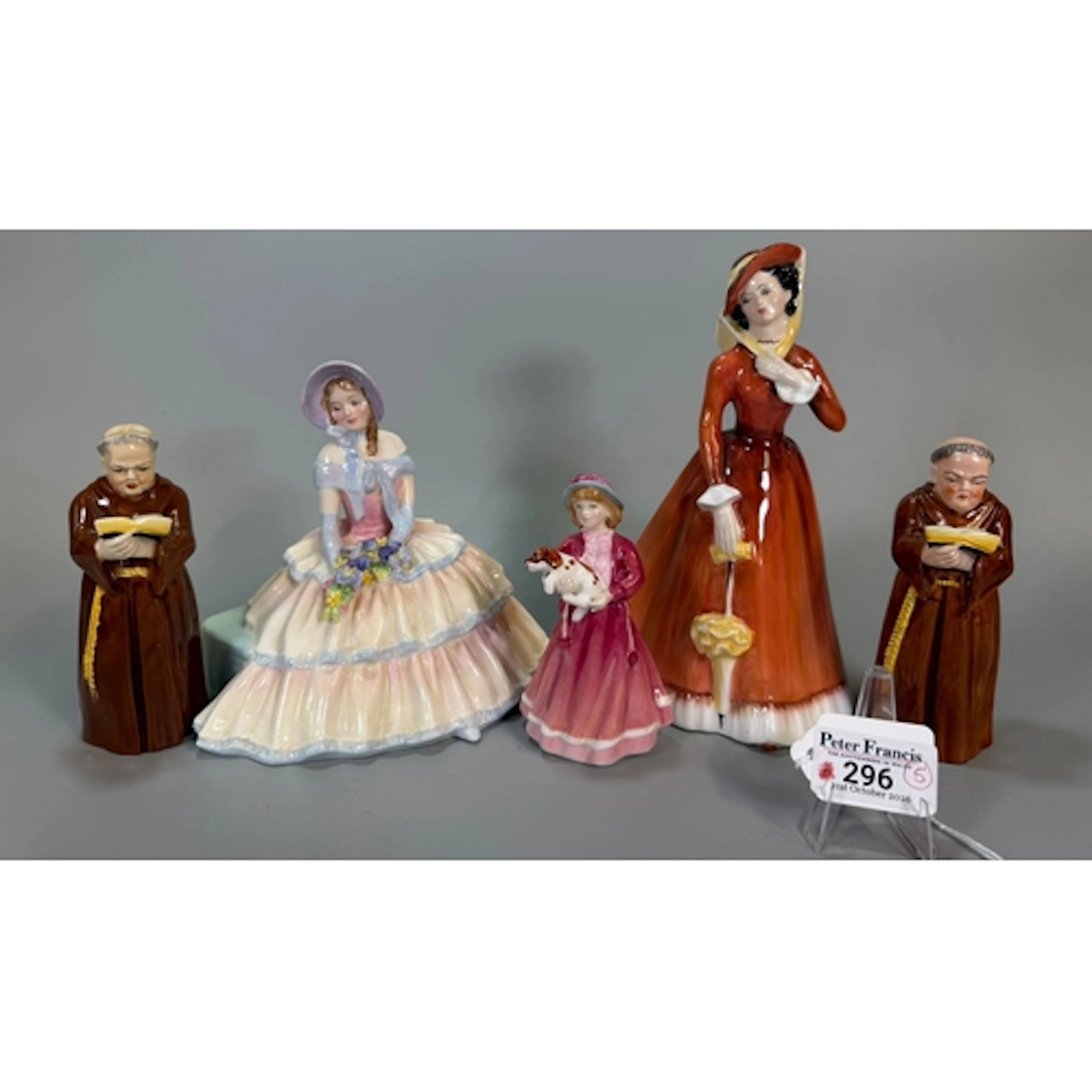 Two similar Royal Worcester porcelain candle snuffers in the...