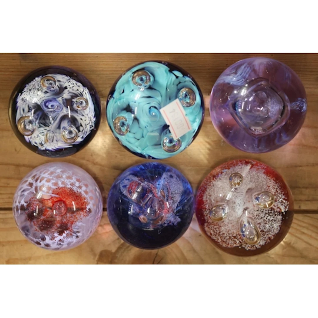 Six Caithness Glass mini paperweights.