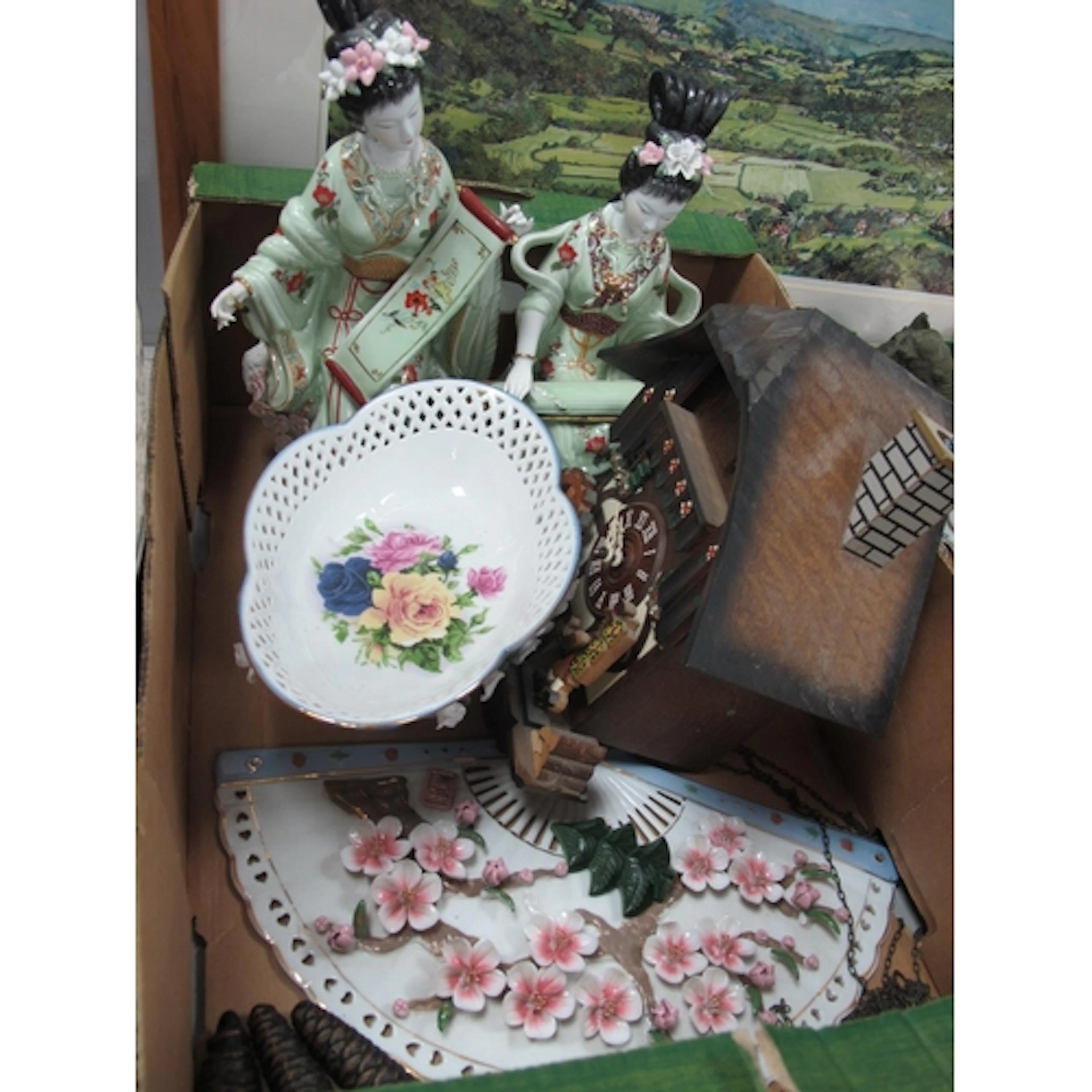 A Pair of Oriental Figurines, fan ornament, table centrepiec...