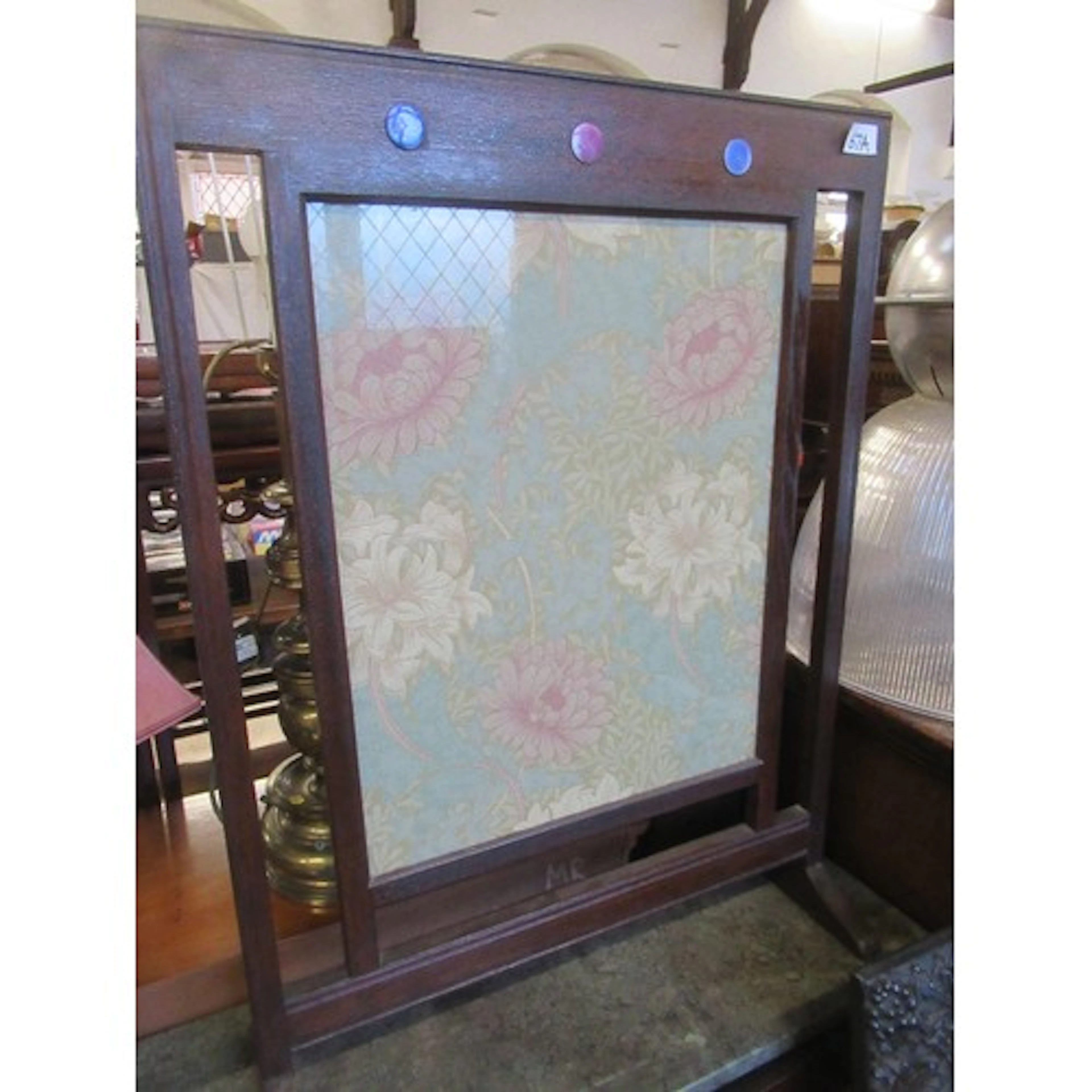 An Arts and Crafts oak fire screen width 23ins height 30ins