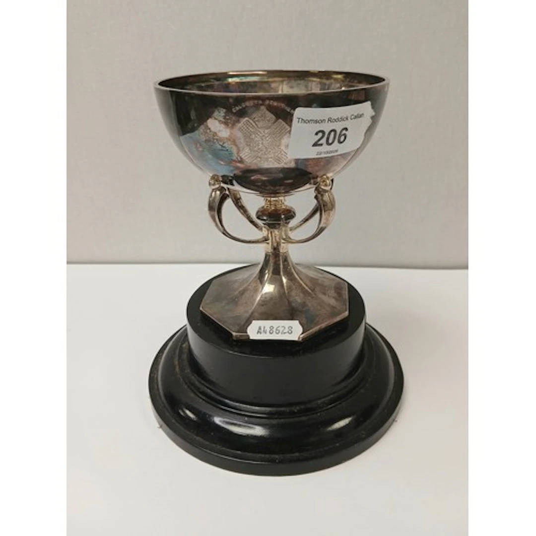 Silver trophy cup on four scroll supports, gross weight 260g...