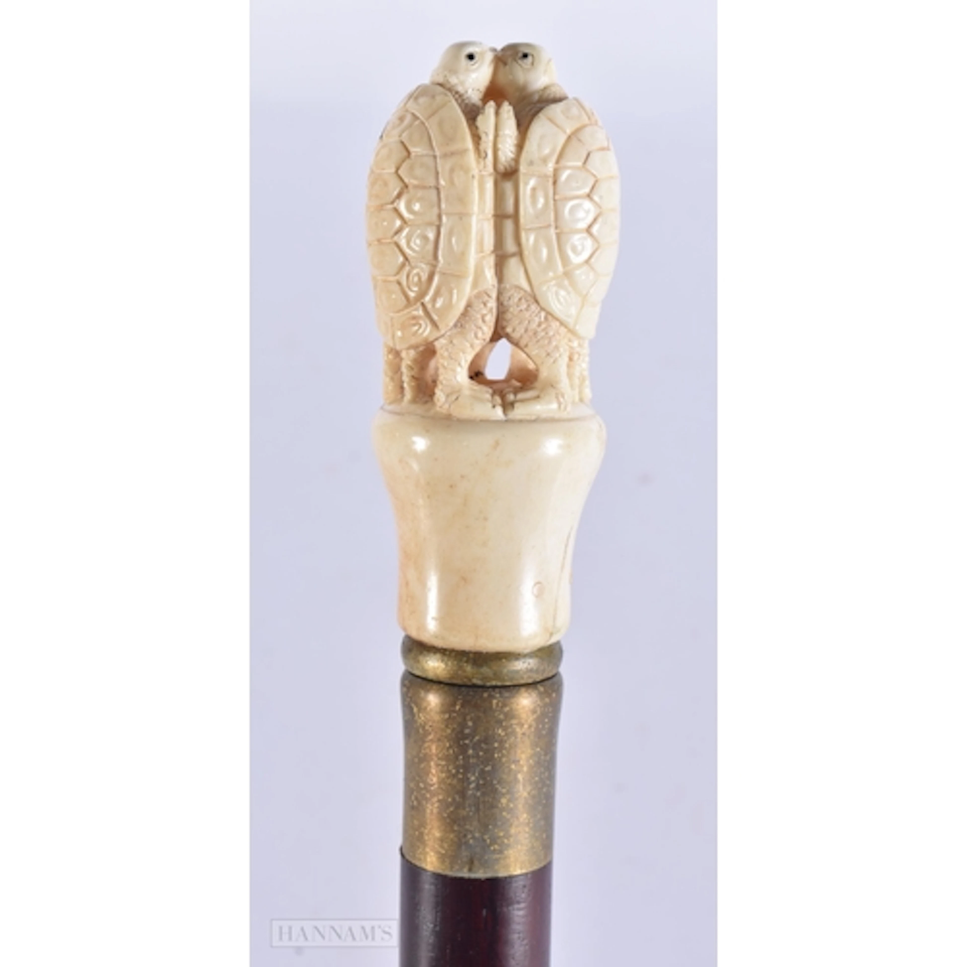 A CARVED BONE WALKING CANE. 90 cm long.