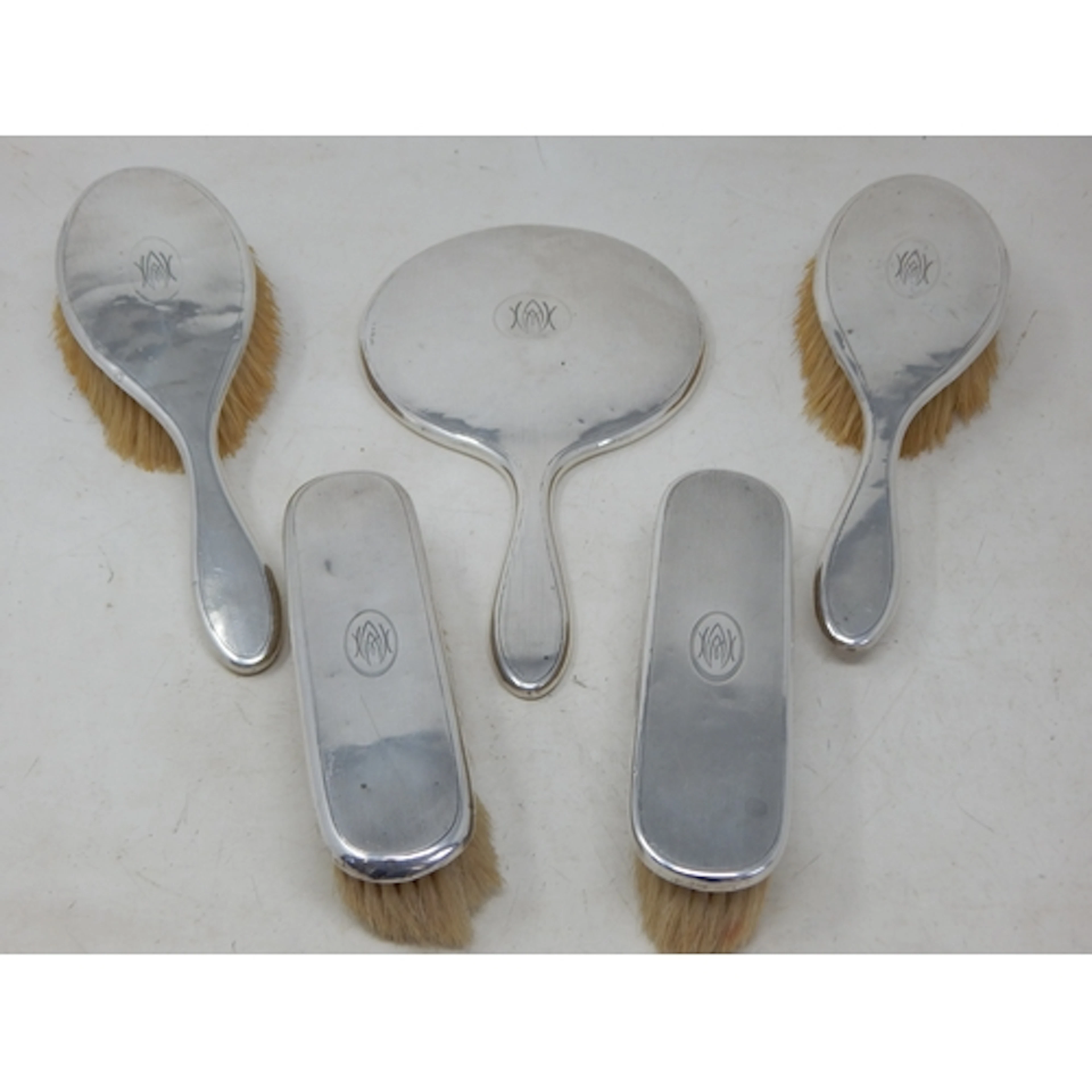 A 5 Piece Silver Dressing Table Set Comprising Hand Mirror &...