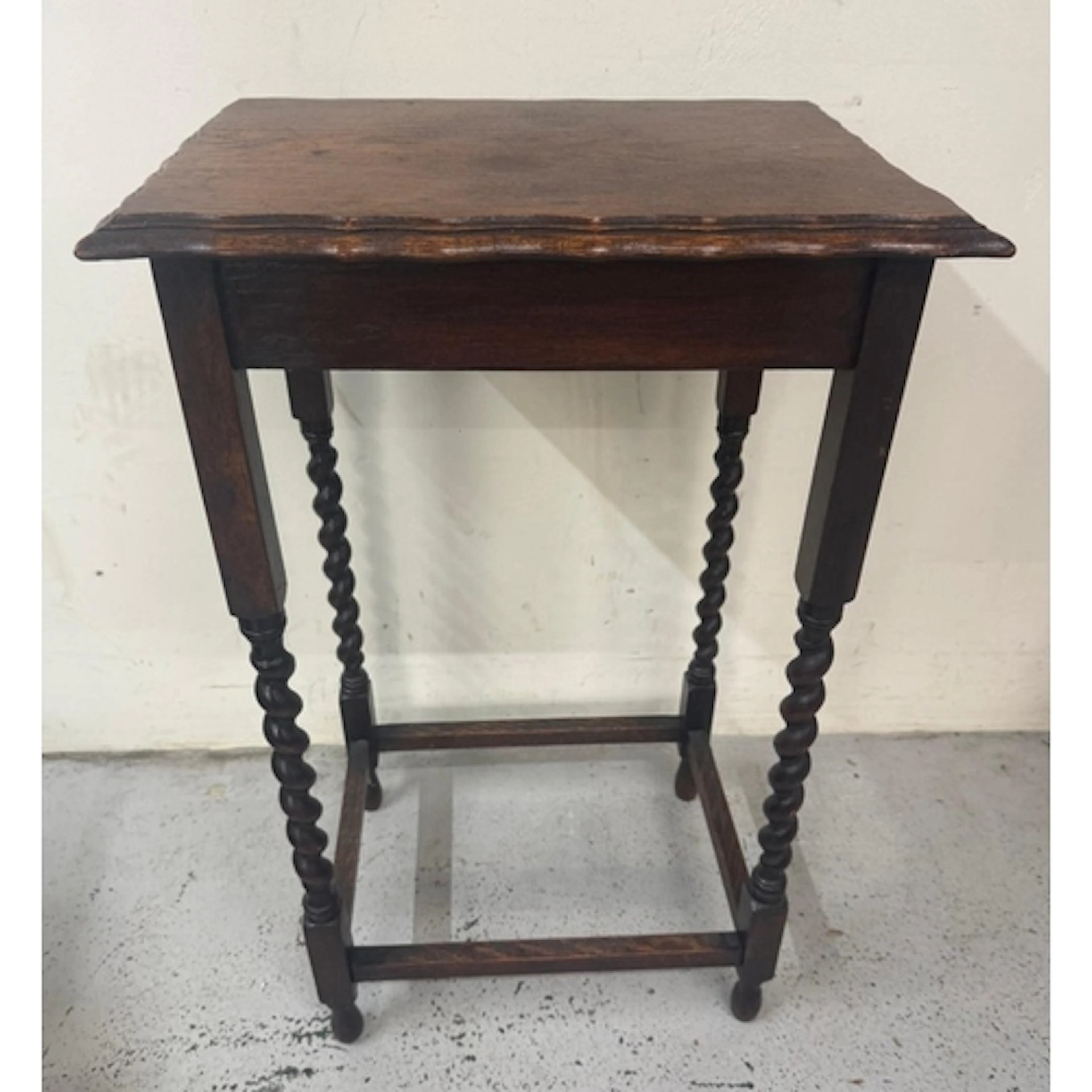 A mahogany side table with pie crust top and barley twist le...