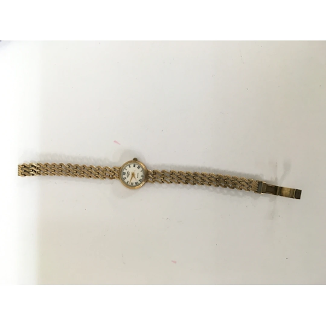 A 9ct gold Rotary lady's vintage wristwatch on woven strap. ...