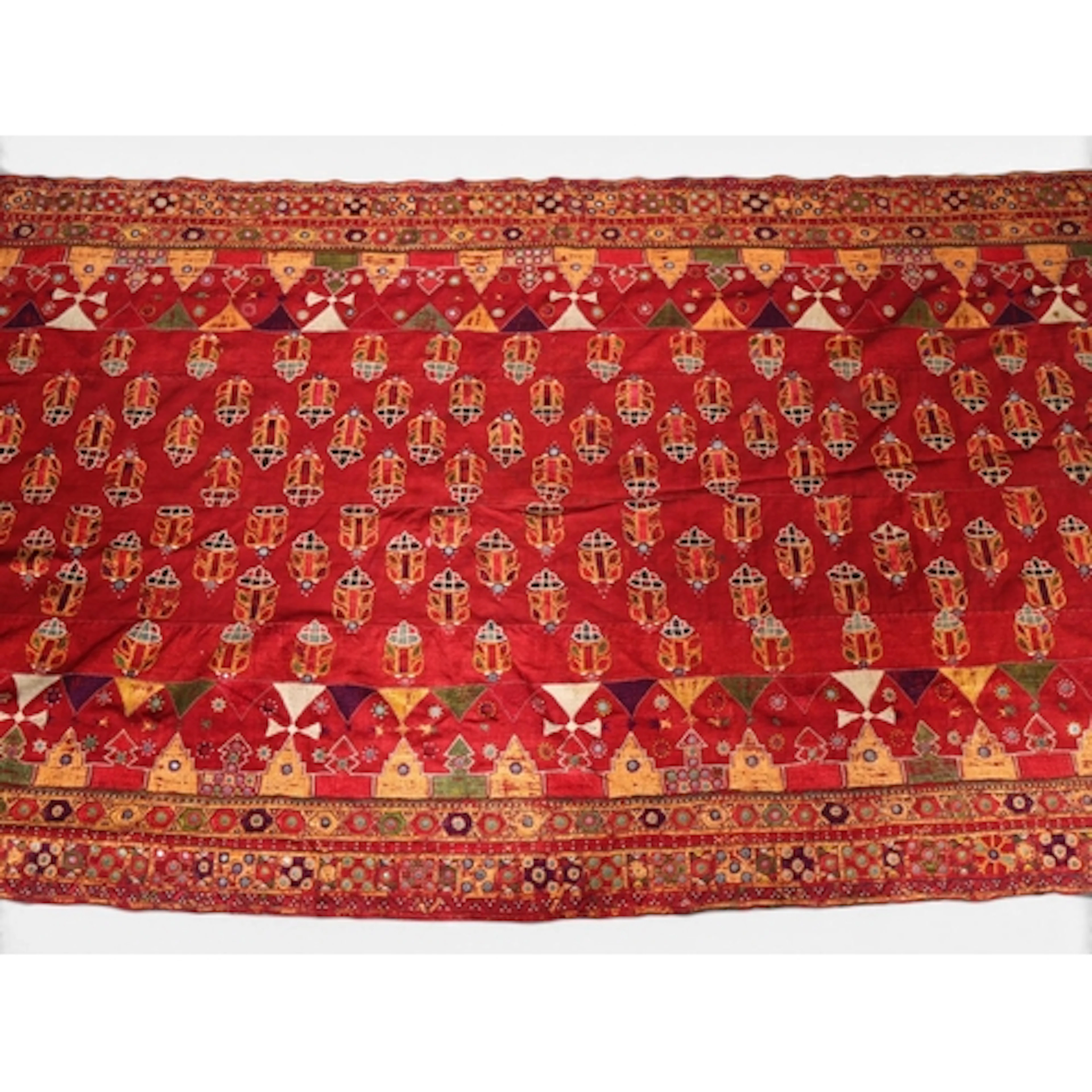 An Indian Gujarat red ground embroidered textile with inset ...