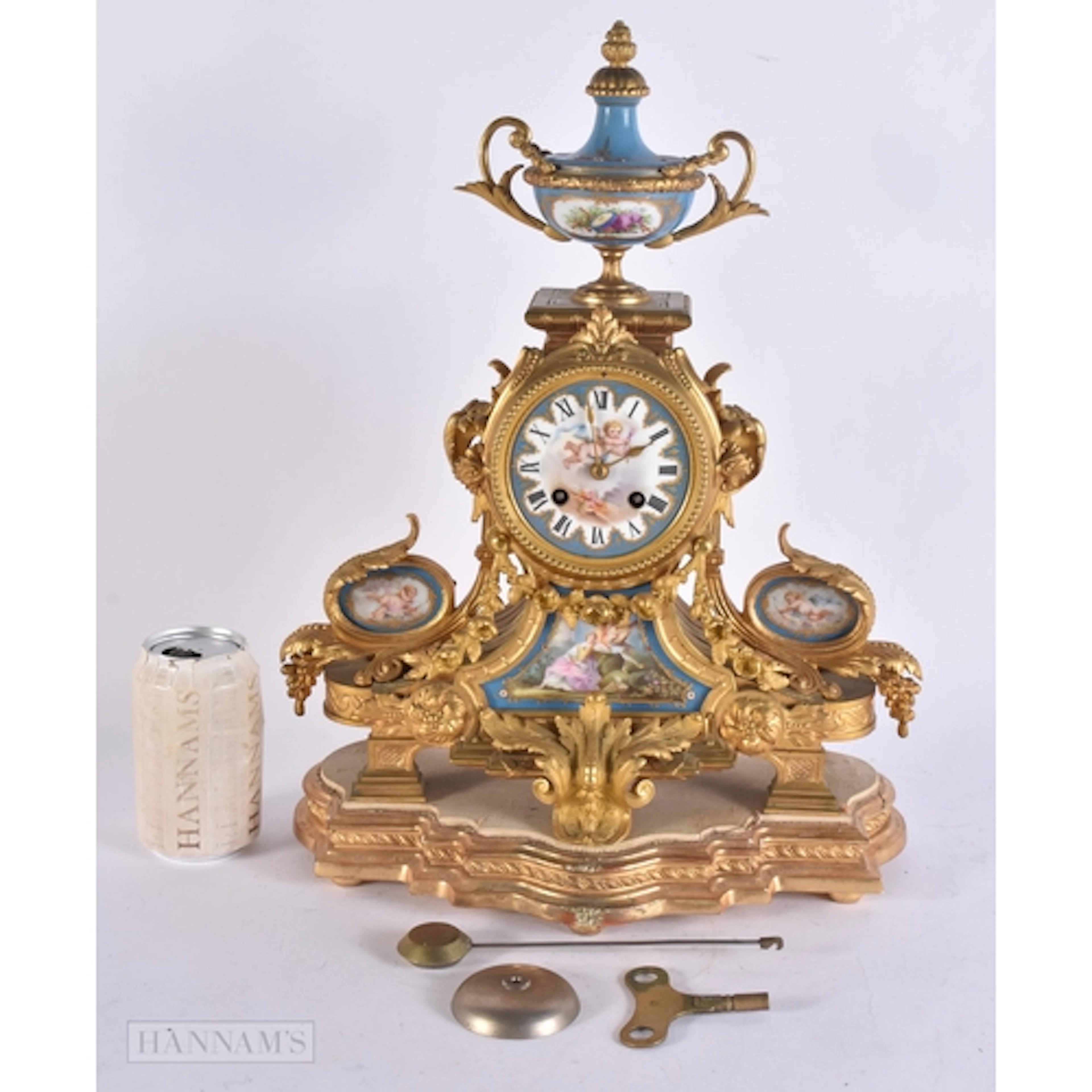 A 19TH CENTURY FRENCH GILT BRONZE SEVRES PORCELAIN CLOCK pai...
