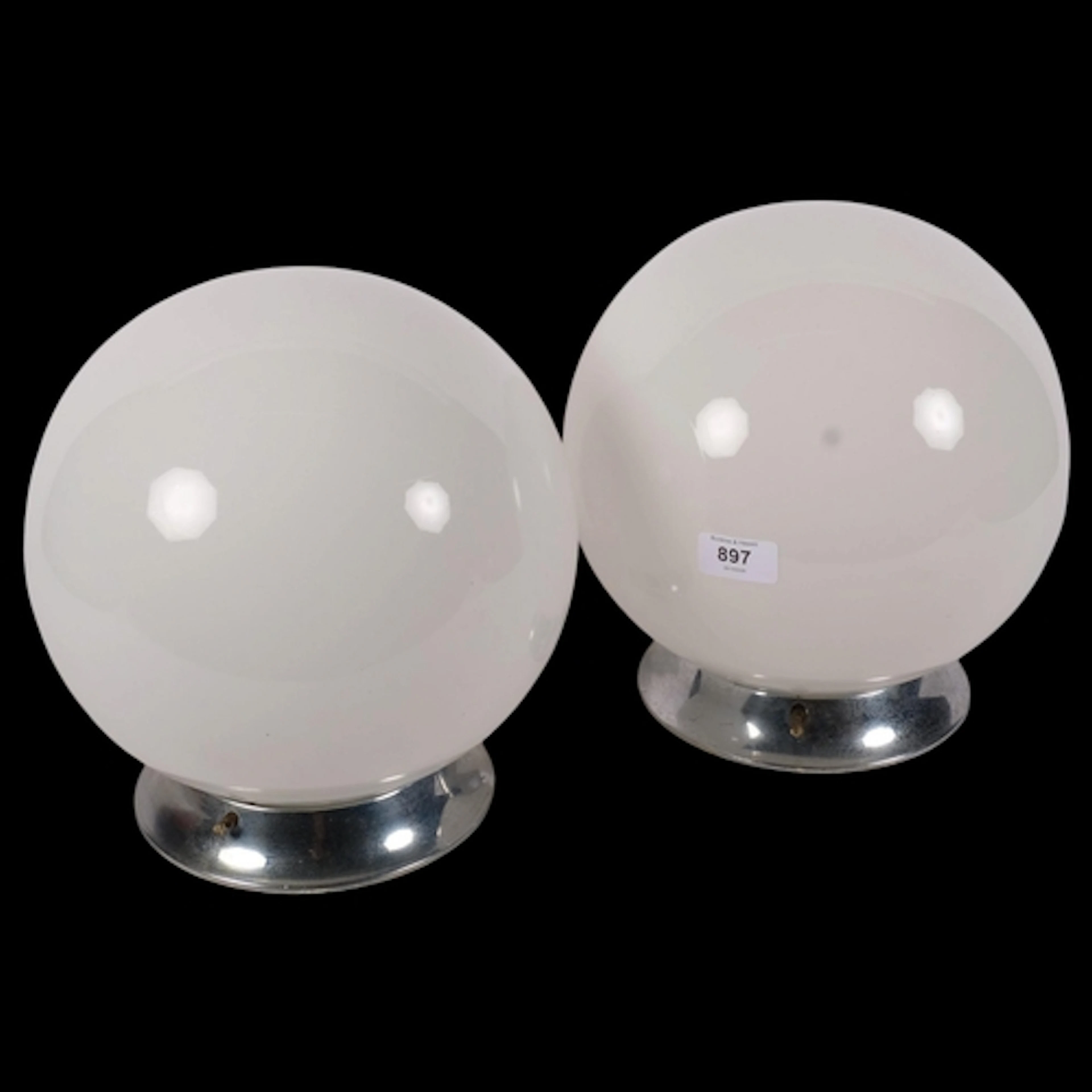 A pair of Vintage globular milk glass light shades with chro...