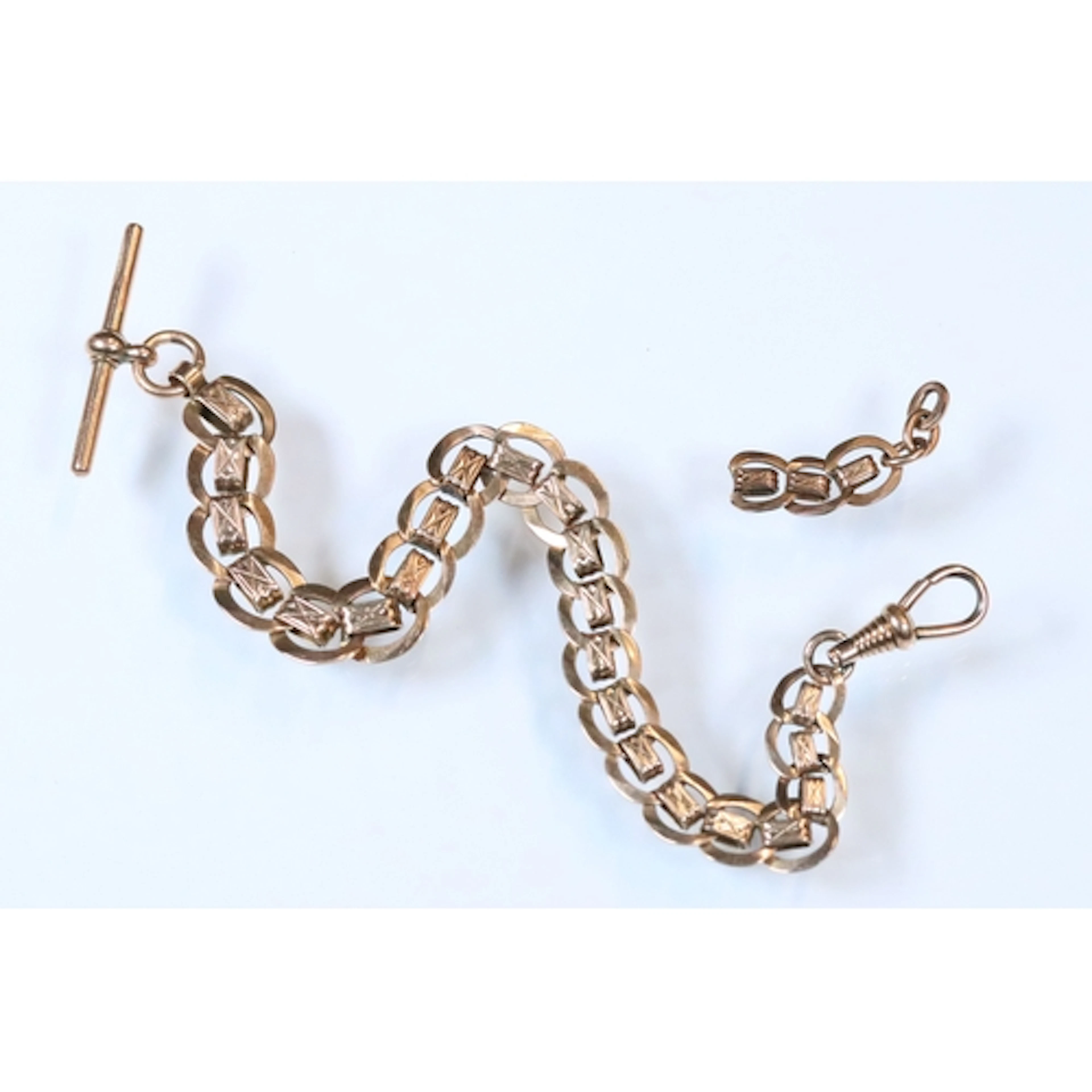 Rolled gold flat link watch chain with dog clasp and a 9ct g...