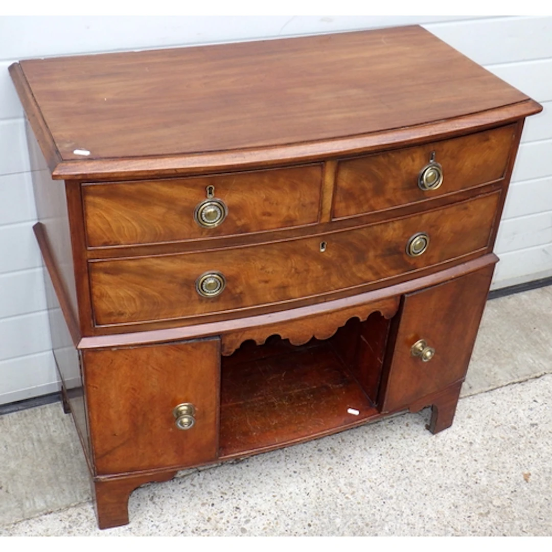 A converted 19th cen bowfronted mahogany chest of drawers wi...