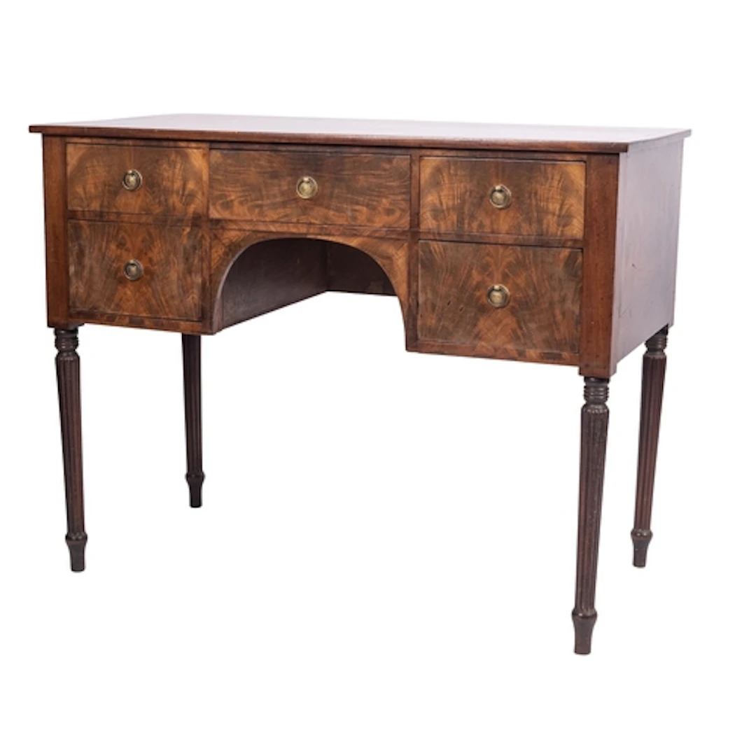 A Regency mahogany and rosewood banded kneehole dressing or ...
