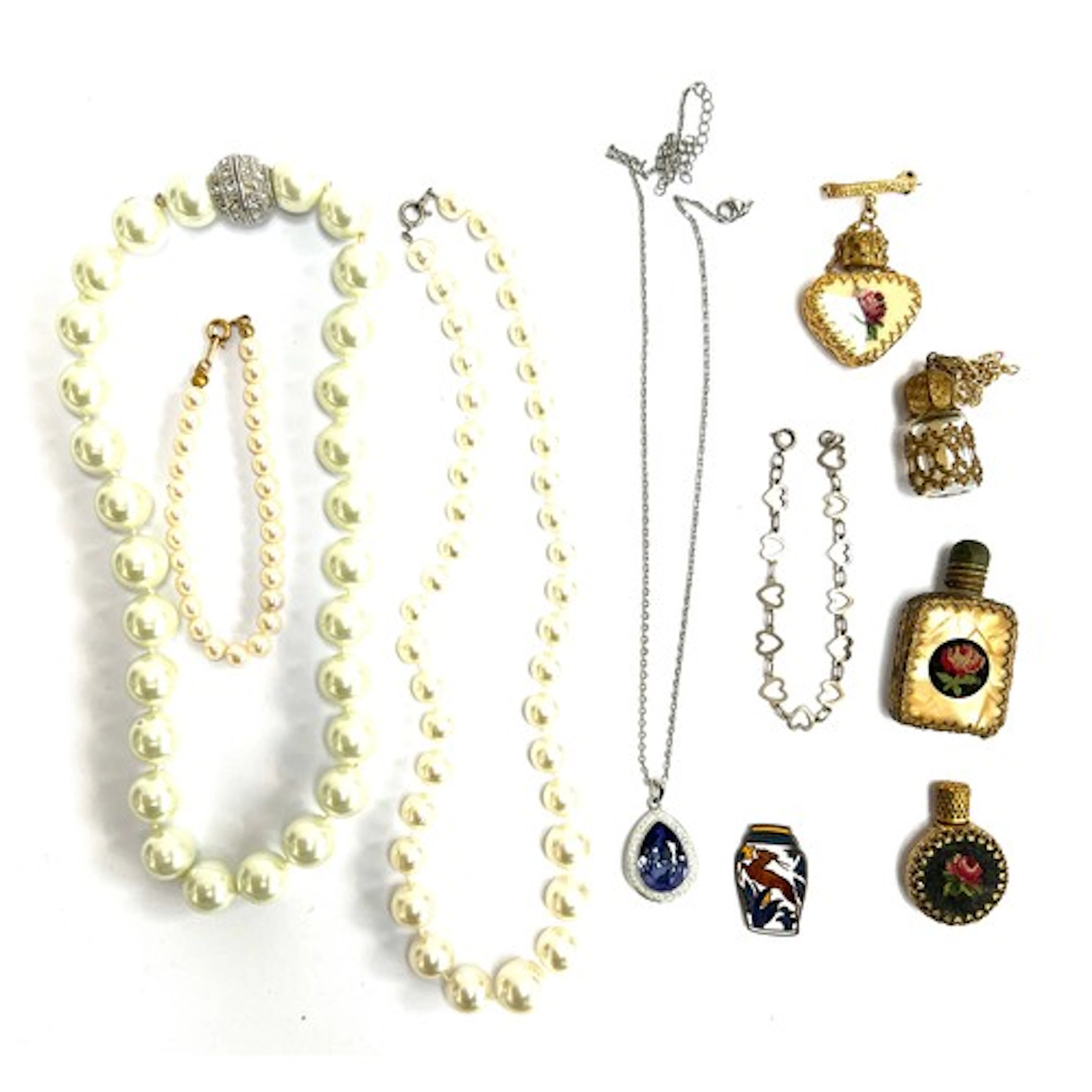 A small lot of jewellery to include Swarovski purple crystal...